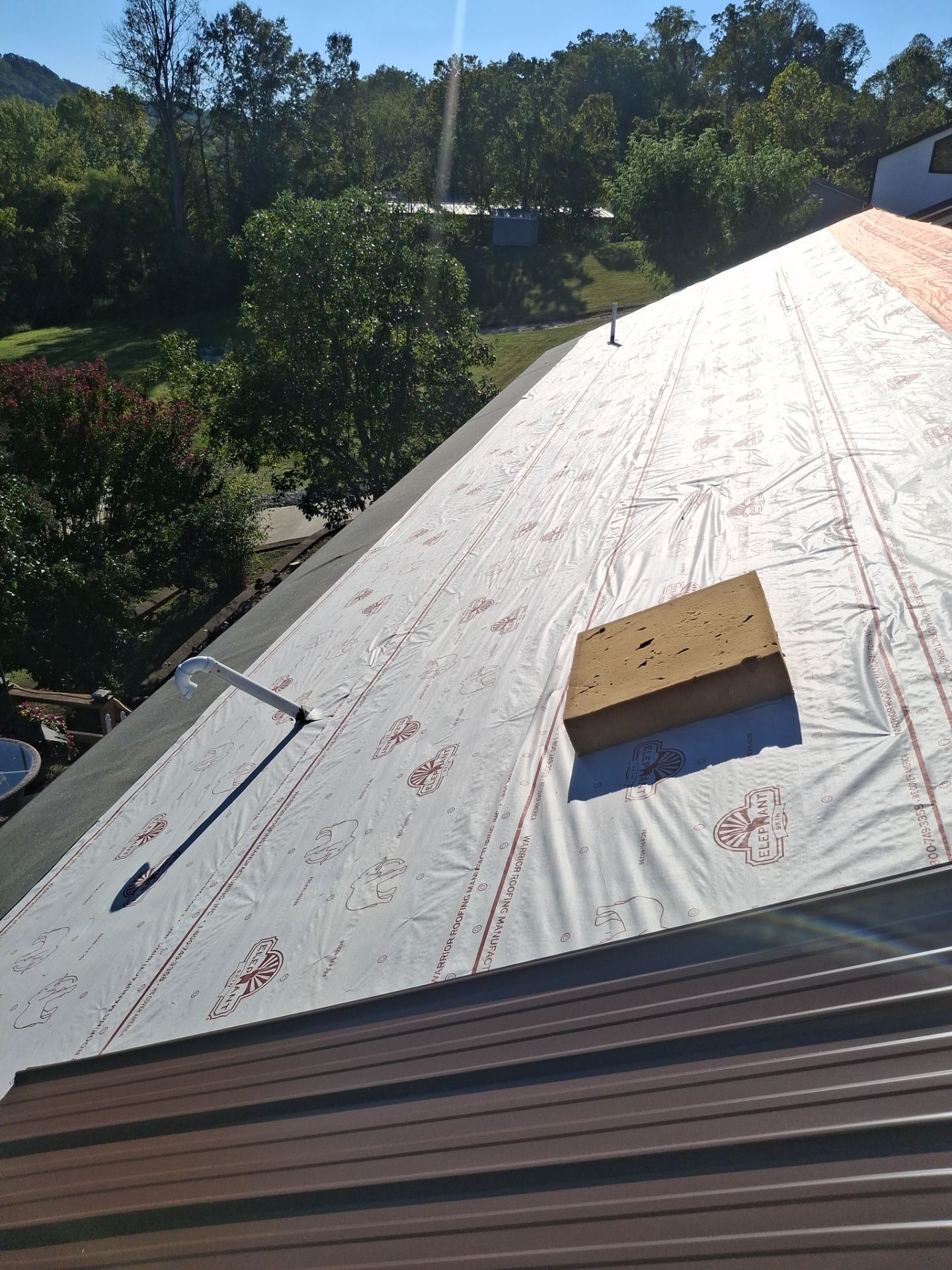 Residential Roofing Installation using Metal by Rainstoppers Roofing