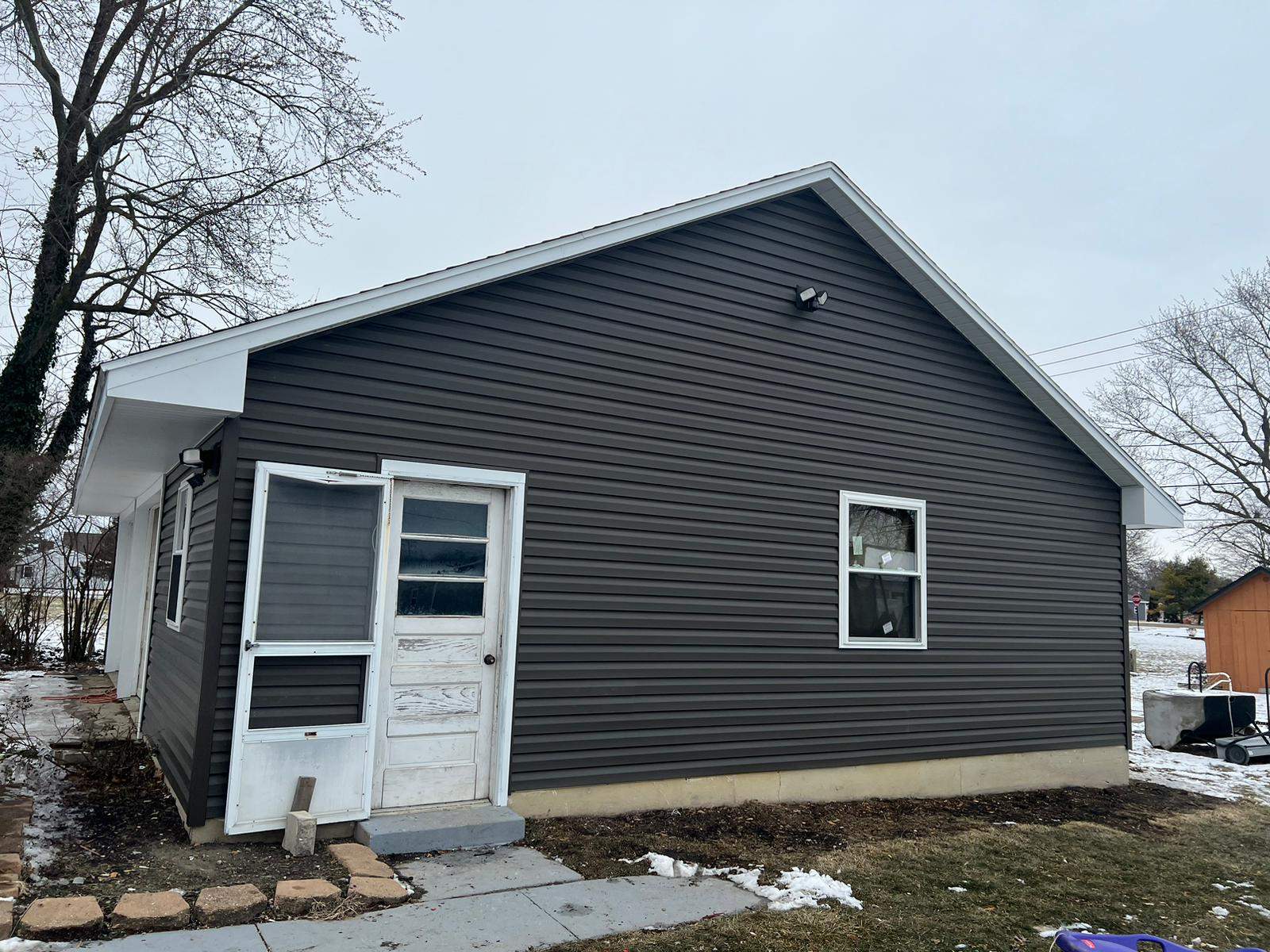 Residential fascia replacement using Exterior Portfolio 4.5 DL - Peppercorn by Nitro Roofing and Construction