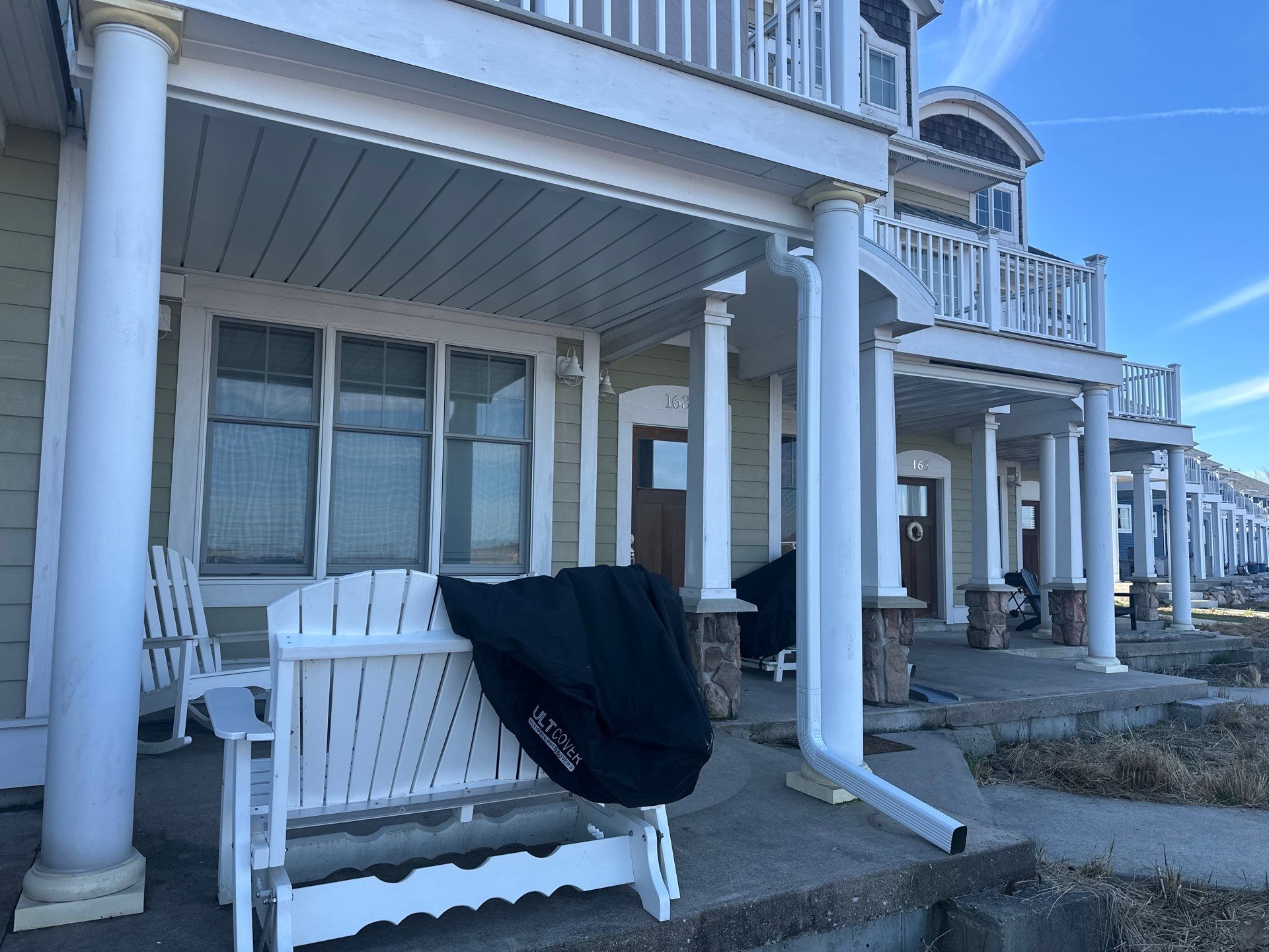 Waterfront Underdeck System Installation and Covered Patio in Manistee by Rainbow Seamless Systems
