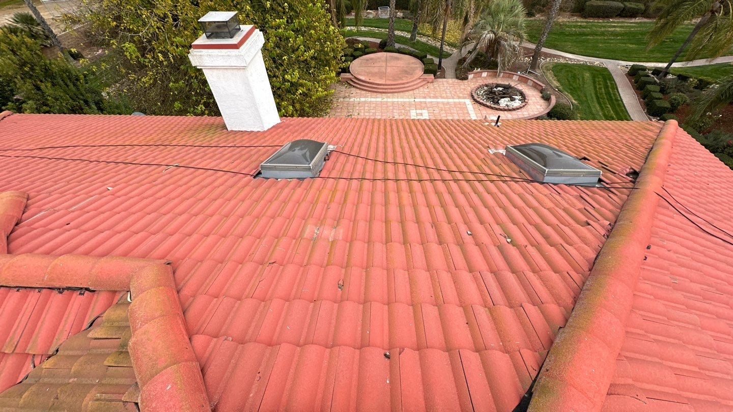 Tile refurbish project using existing tiles and replaced underlayment and battens by Straight Edge Roofing Inc