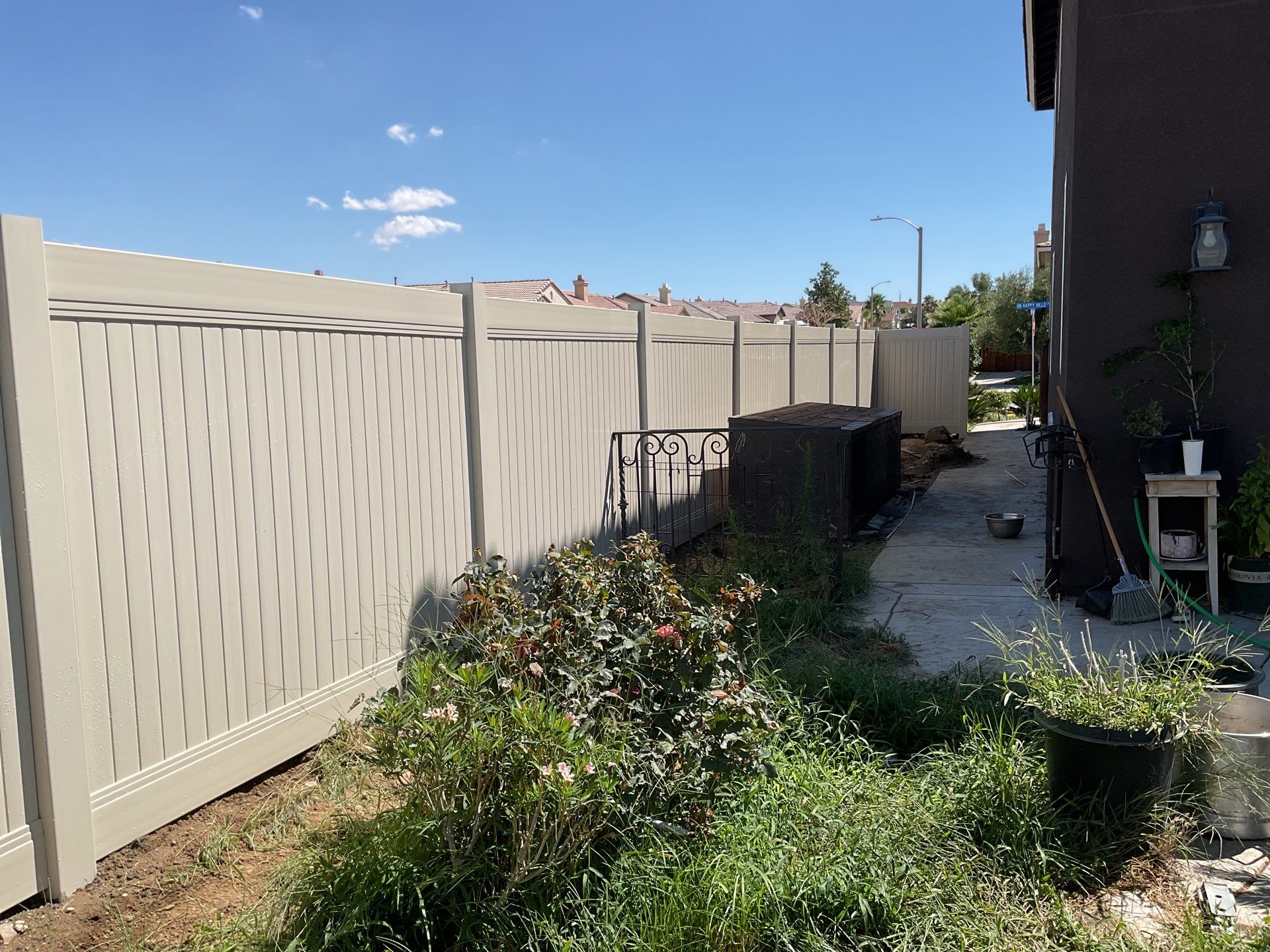 Tan Vinyl by Fence Guys Inc. 