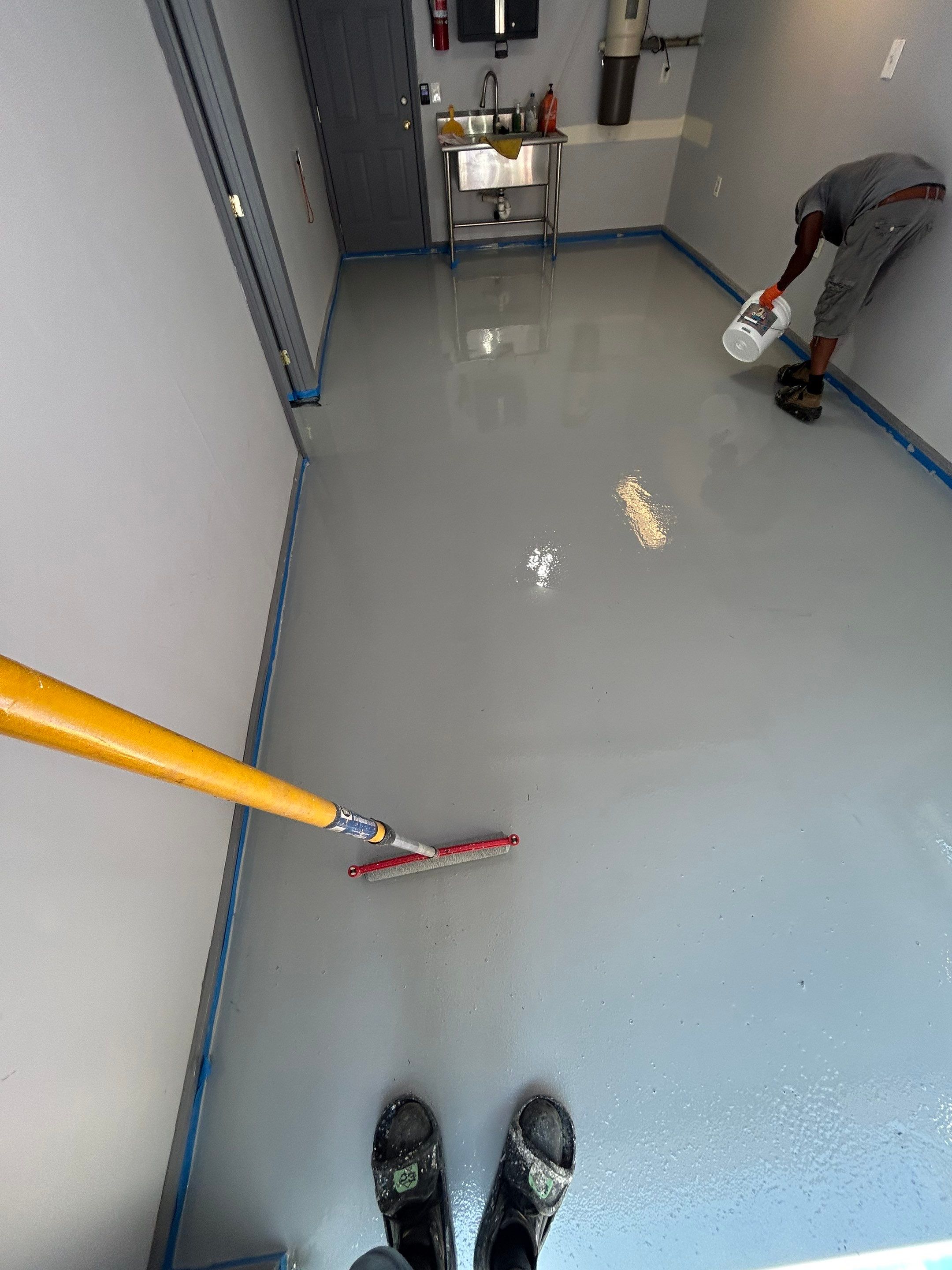 Concrete Floor Coating Transformation by DiGiorgi Roofing and Siding Inc