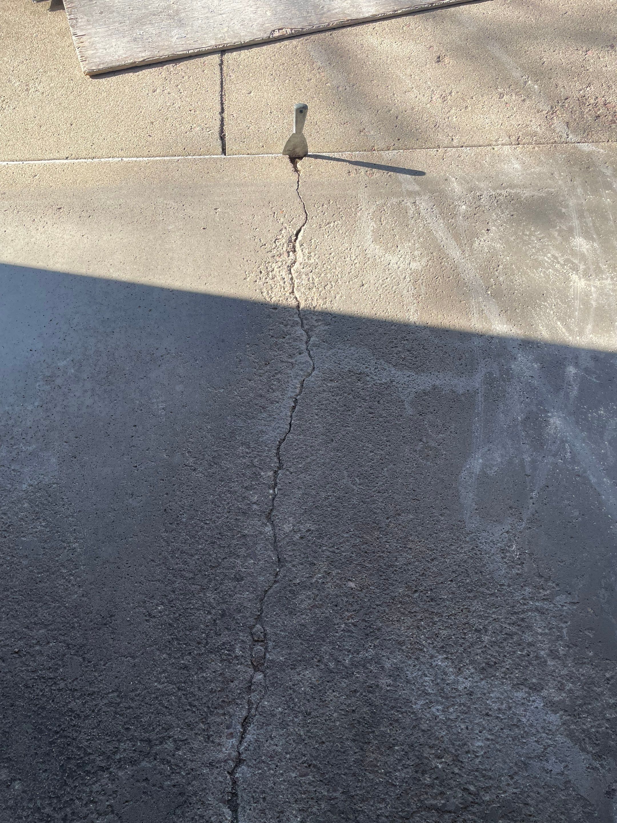 Yankton Garage Floor Restoration with Gray Speckled Epoxy Coating by Select Painting, Coatings & Garage Cabinets