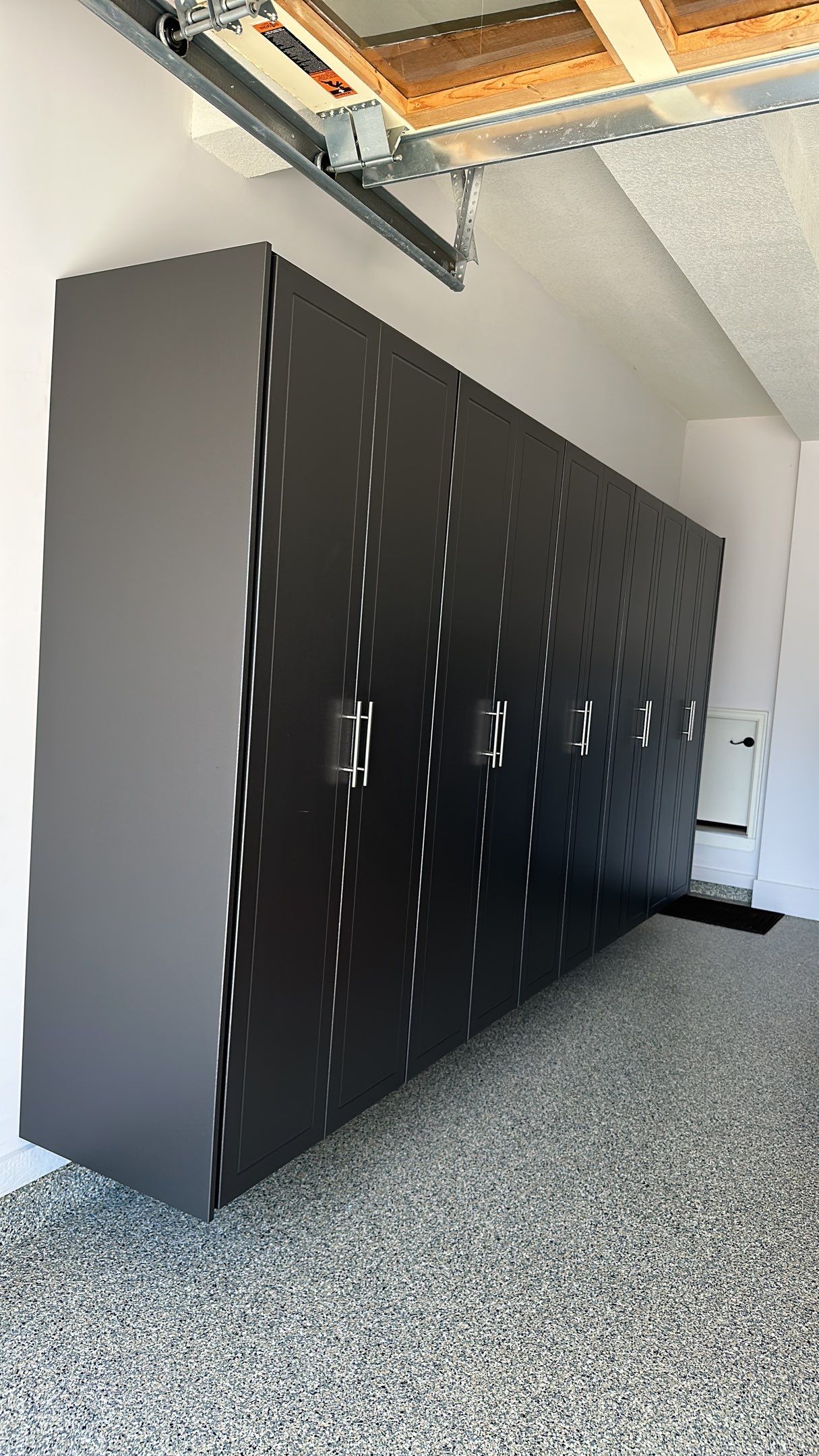 Lori H. upgrade her garage with cabinets and overhead racks by Banner Garage