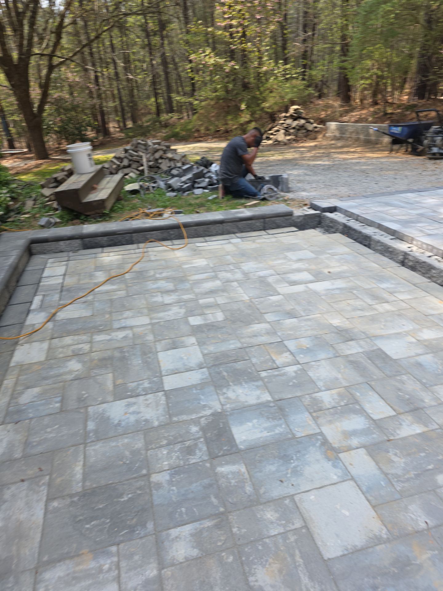 Pittsboro Outdoor Living Transformation – Retaining Wall, Paver Patio & Elevated Deck by Elite Remodeling and Design LLC