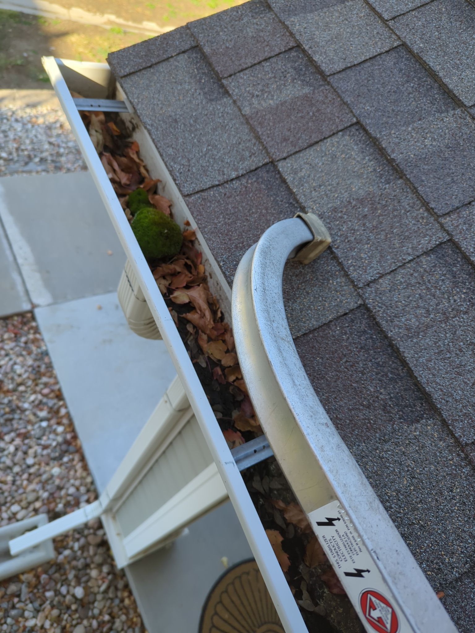 Commercial gutter cleaning Fort Collins / Loveland before photo with filled gutters