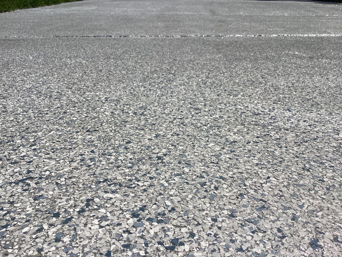 Driveway and Garage using Tidal Wave by Amvet concrete coatings llc