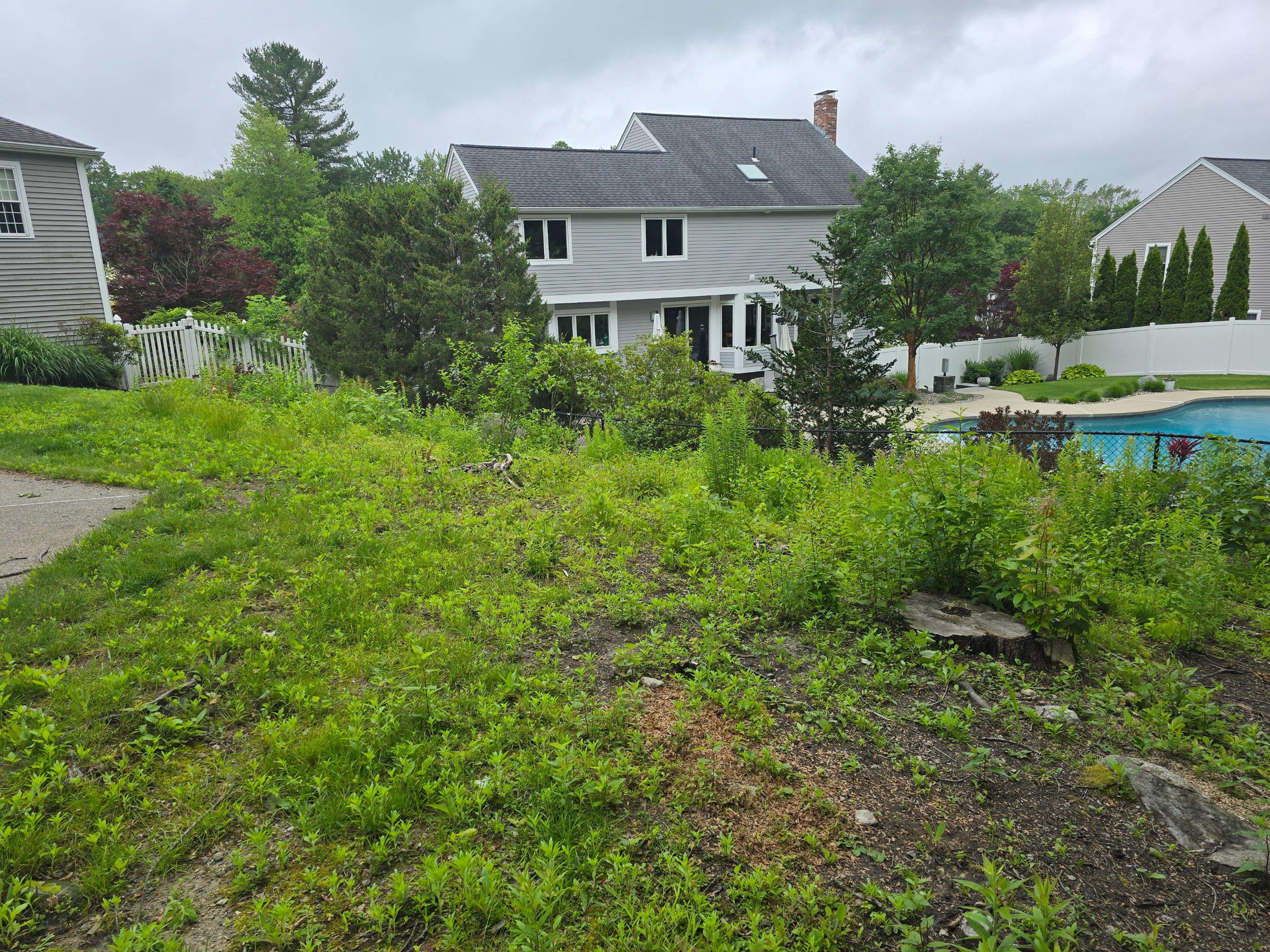 Retaining Wall to Level Backyard  by May Property Management 