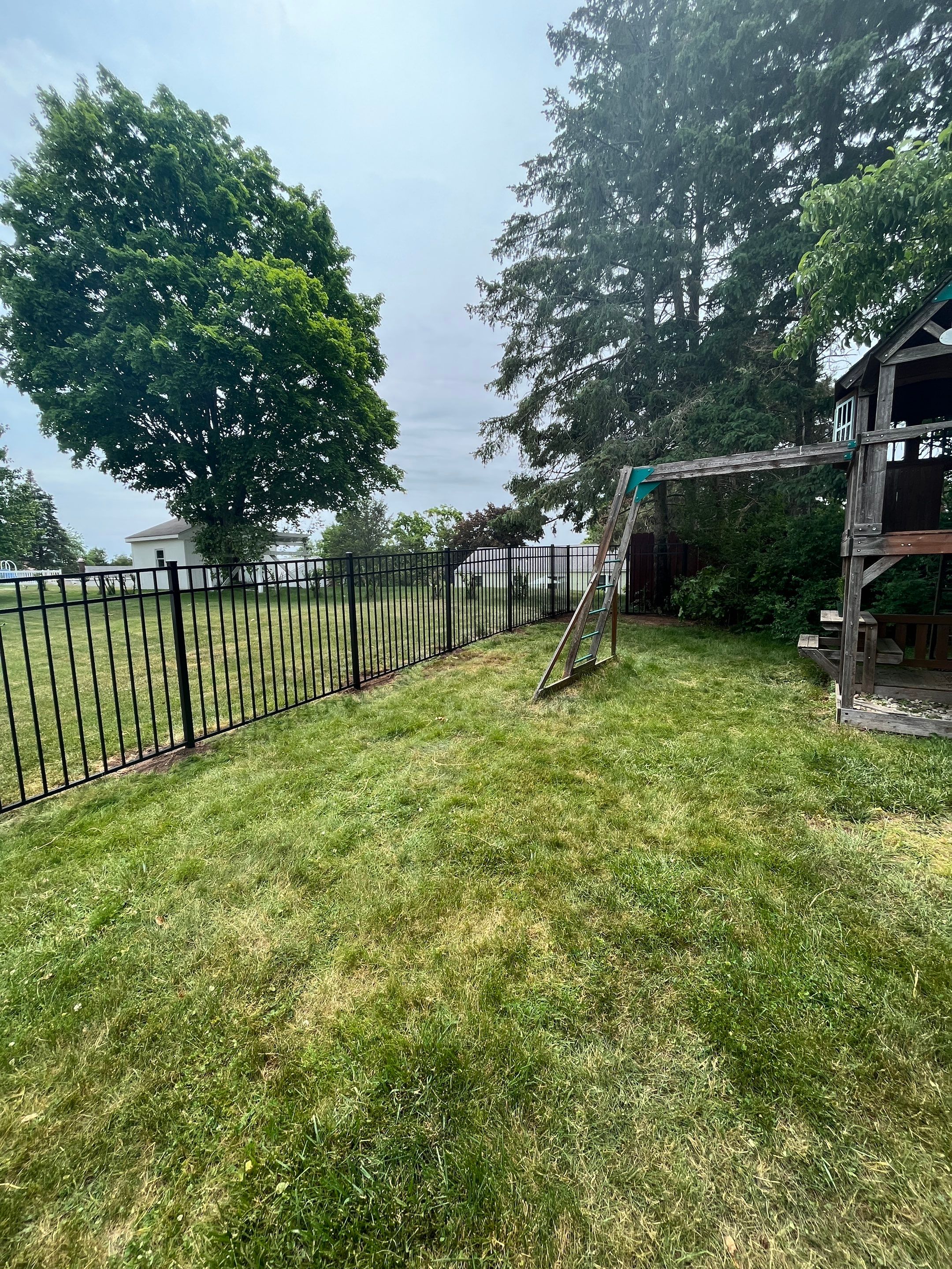 Aluminum Fence in Black, with matching Arched gate by DiGiorgi Roofing and Siding Inc