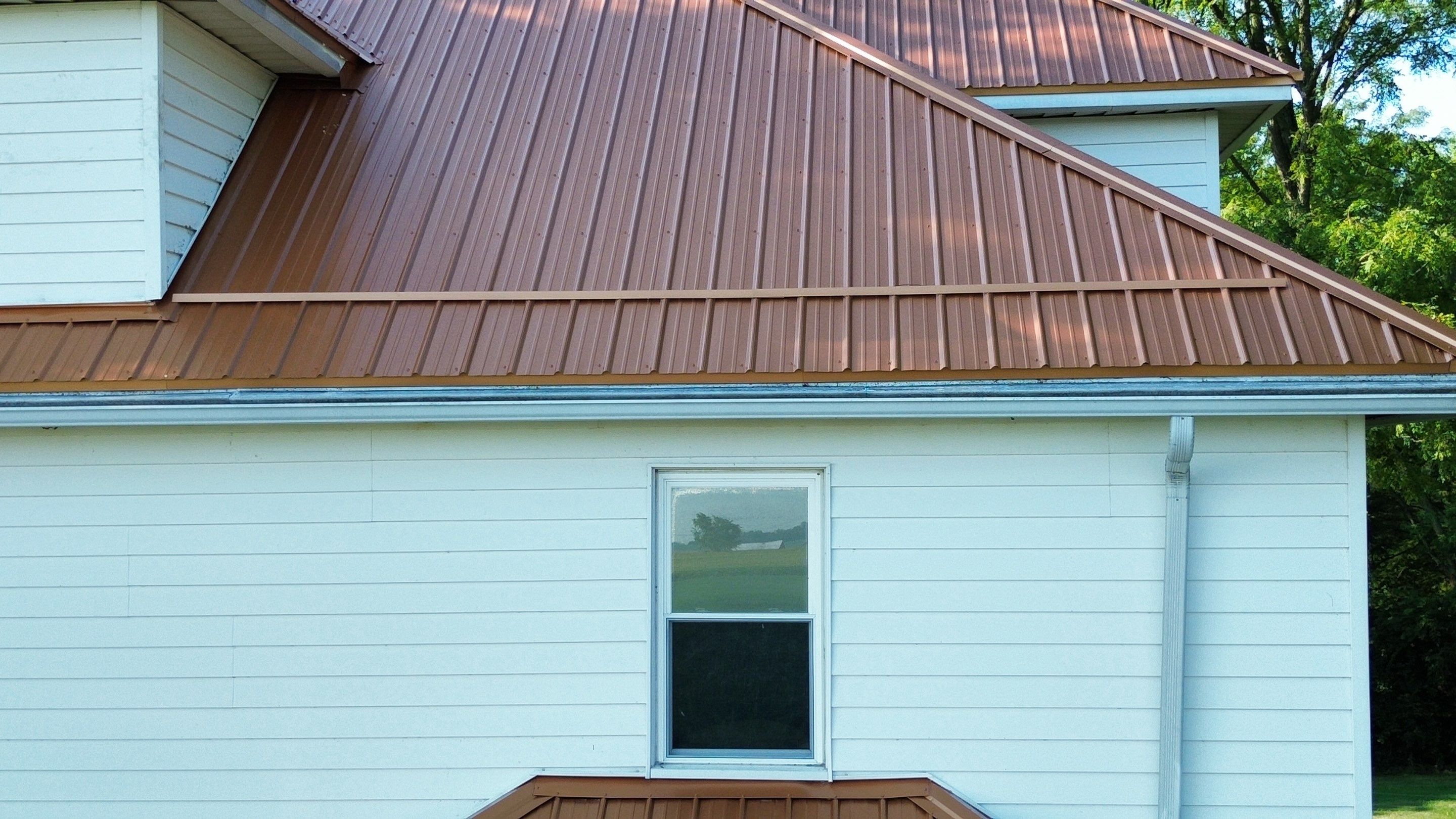 Residential Roofing Installation using Performance Panel Metal - Copper Metallic by RoofX 