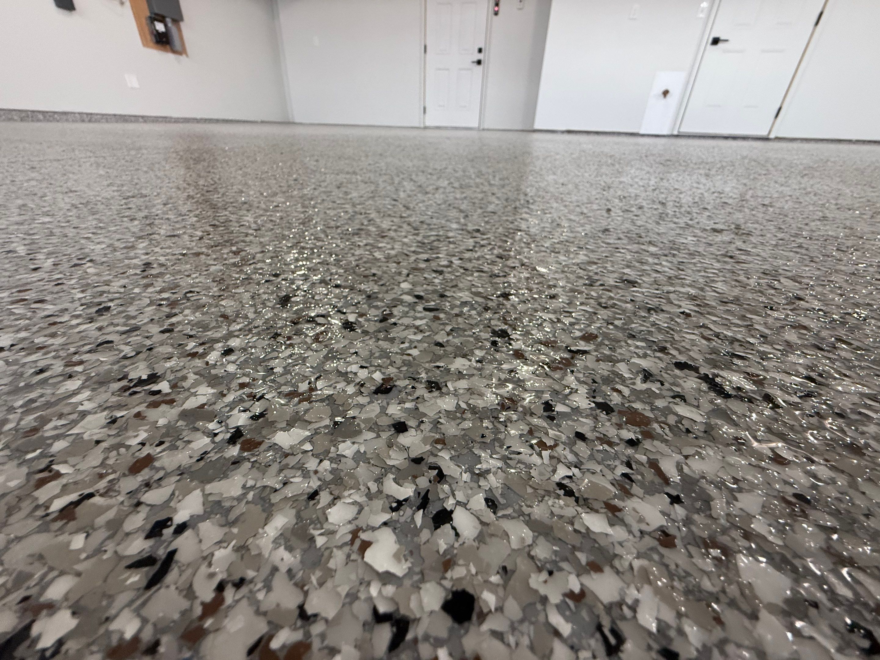 High-Gloss Epoxy Flake Garage Floor Coating in Brandon by Select Painting, Coatings & Garage Cabinets