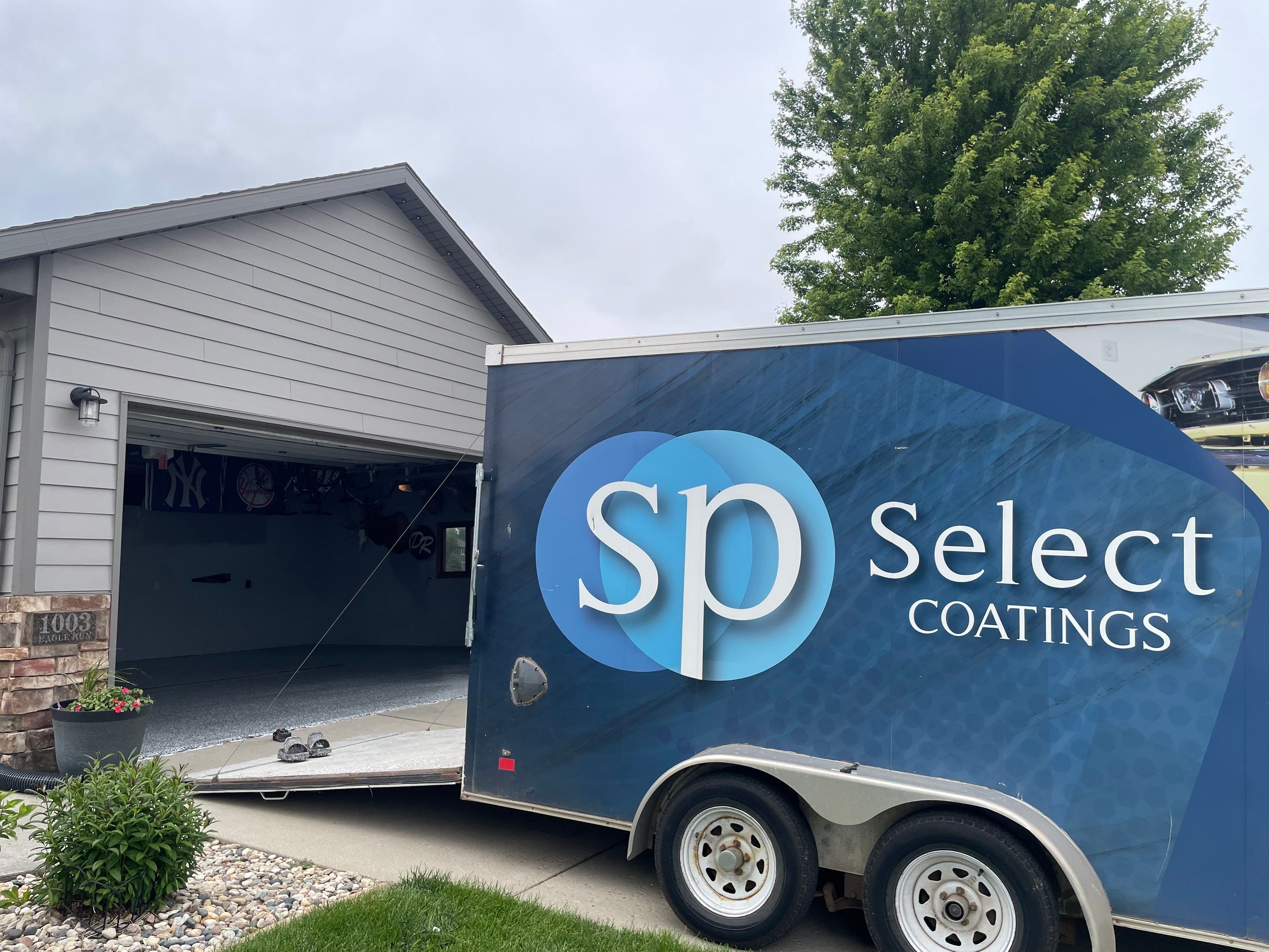 Full Garage Floor Epoxy Coating Installation in Dell Rapids by Select Painting, Coatings & Garage Cabinets