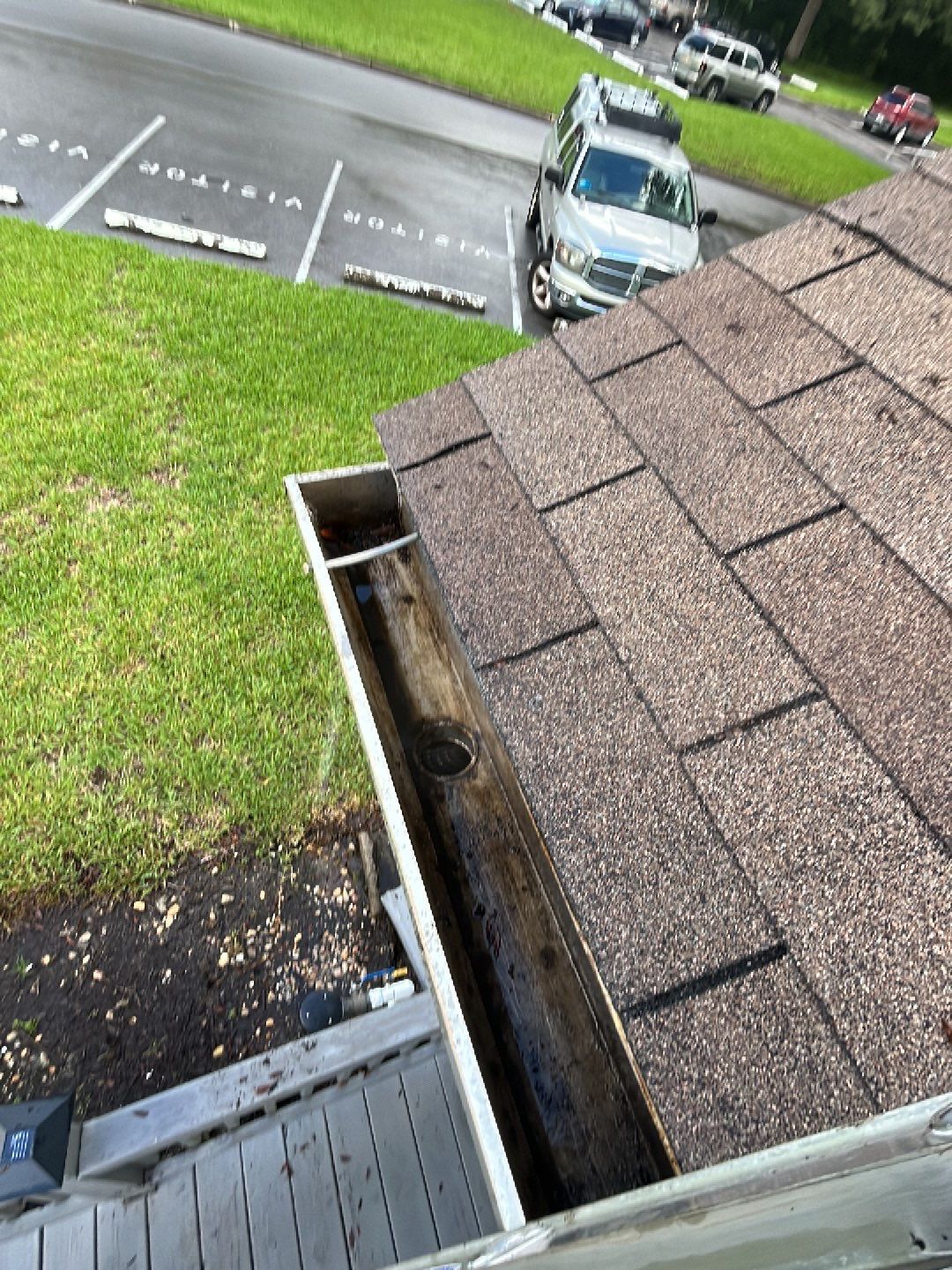 HOA gutter cleaning in Spring Hill, FL, after  photo showing full gutters.