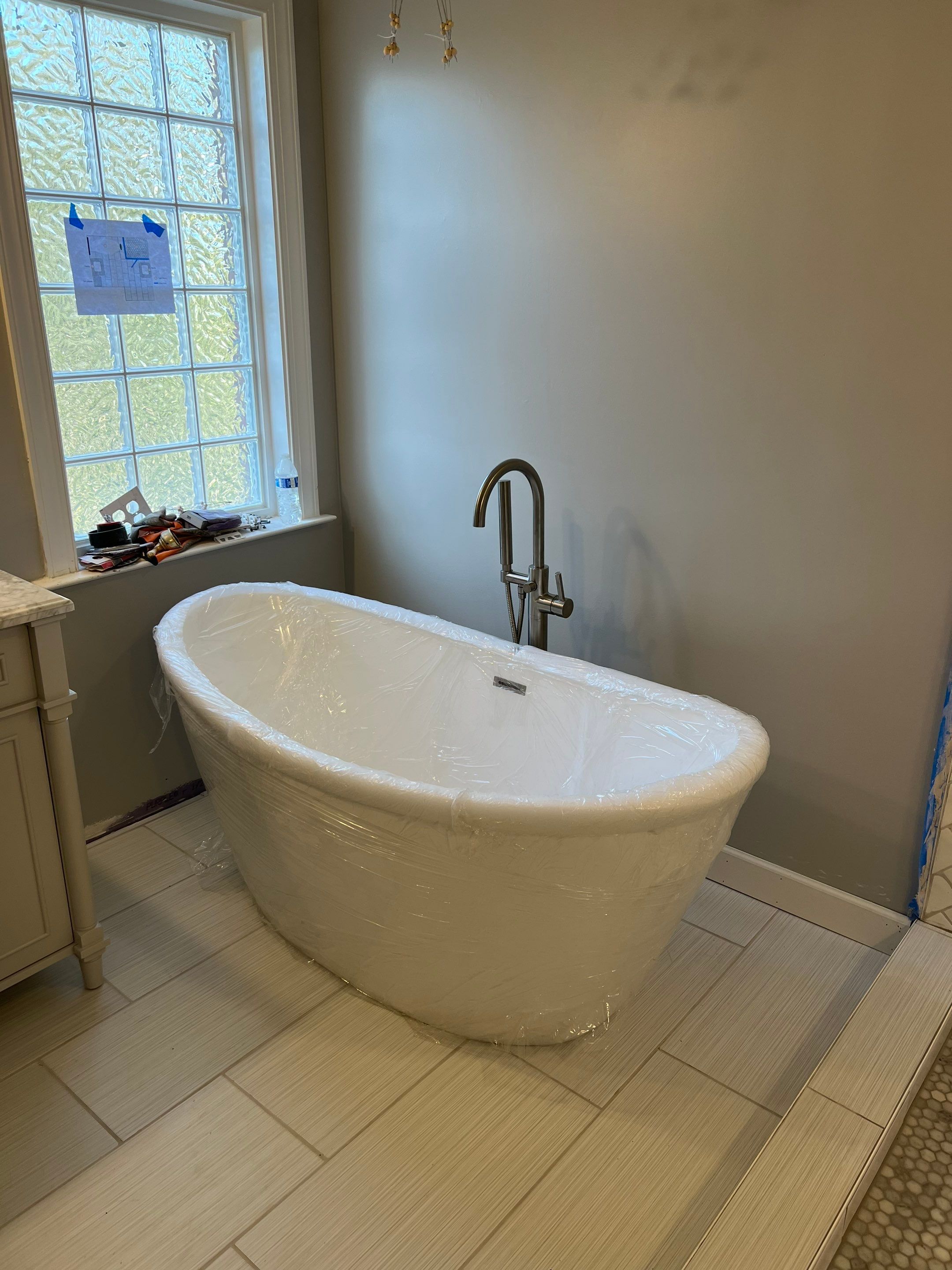 Bathroom Remodel using Schluter by Footprints Floors of Coastal Carolina