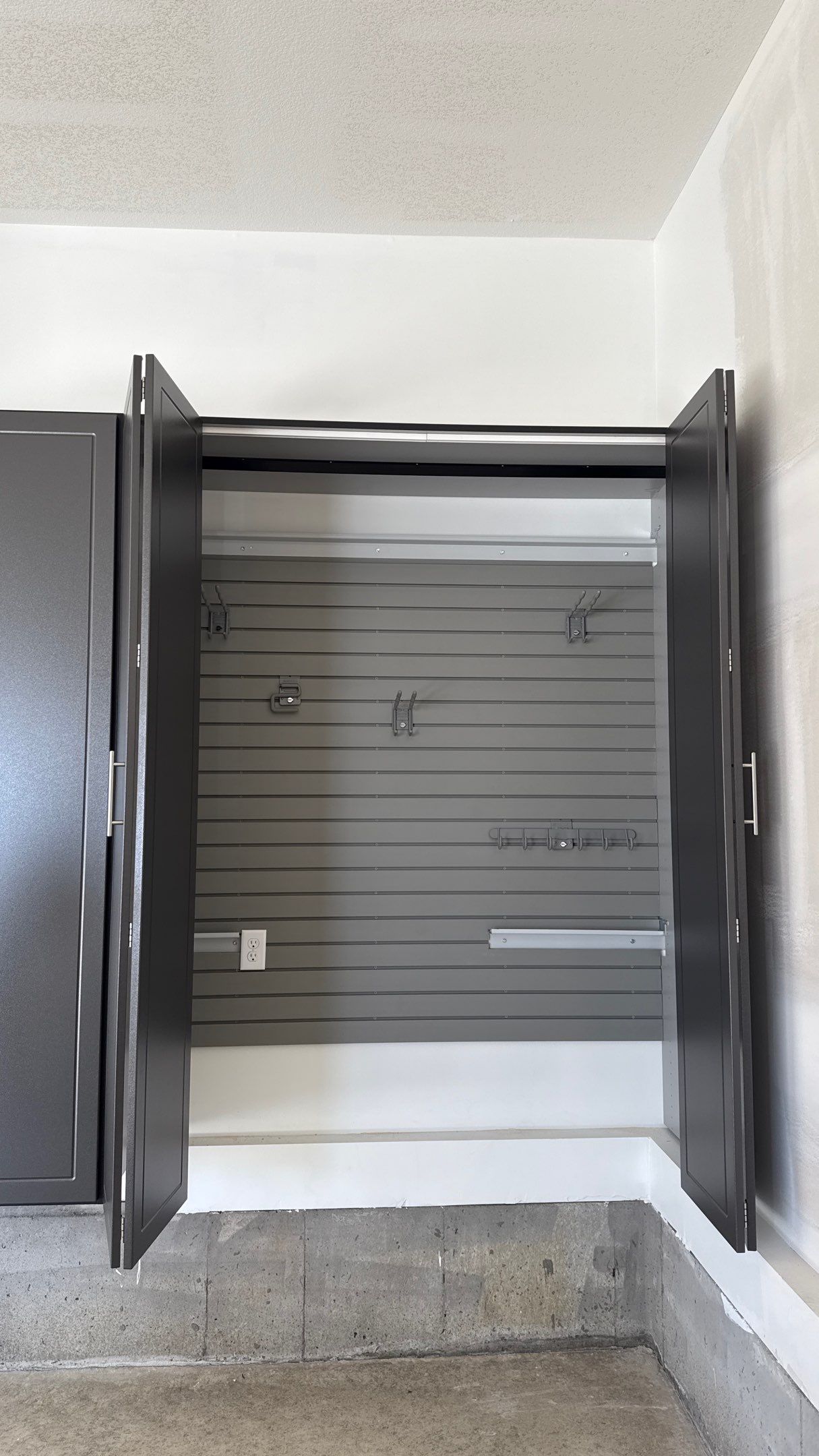 Nice Clean Look With These Pewter Cabinets by Banner Garage