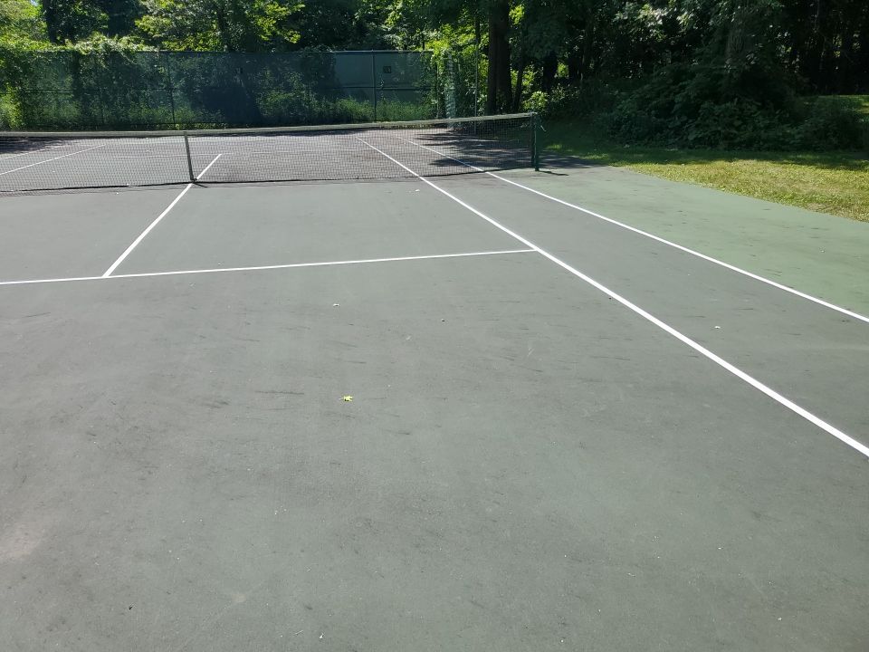Deck, Patio, and Tennis Court Cleaning by Northern Power Washing LLC.