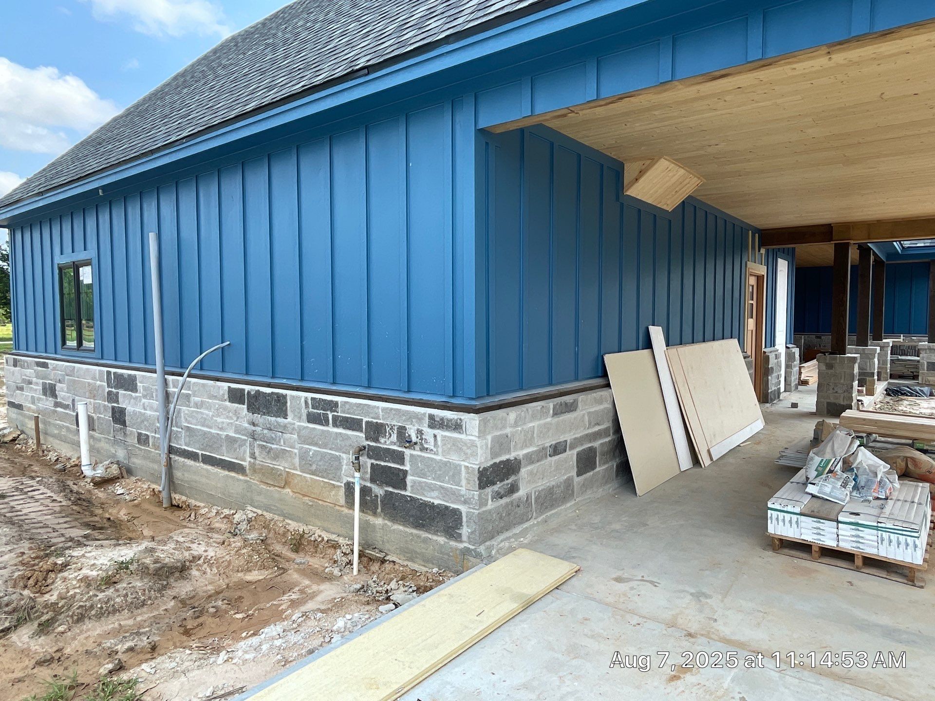 Natural Stone Elegance: Apex Installation Accented by Blue Siding by Apex Conventional Stucco Llc