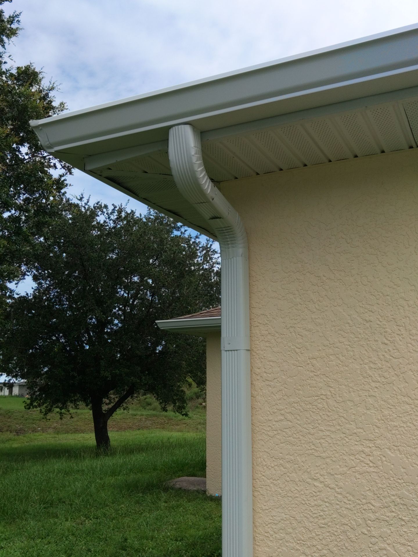 Seamless gutters in Lehigh Acres, FL provide a strong and efficient solution for managing heavy Florida rainfall by Gutter Professors