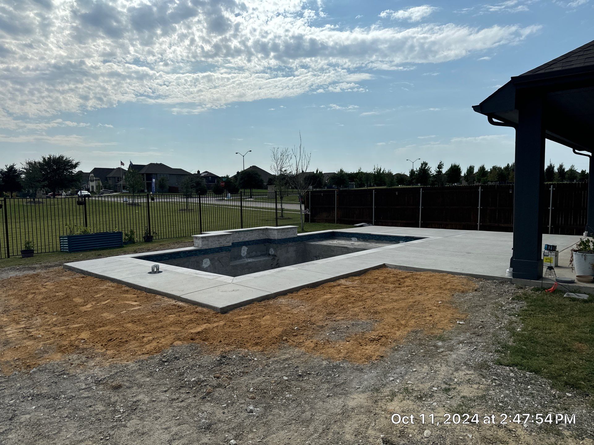 Modern Geometric Pool with Expansive Deck by Pinnacle Pools and Spas - DFW