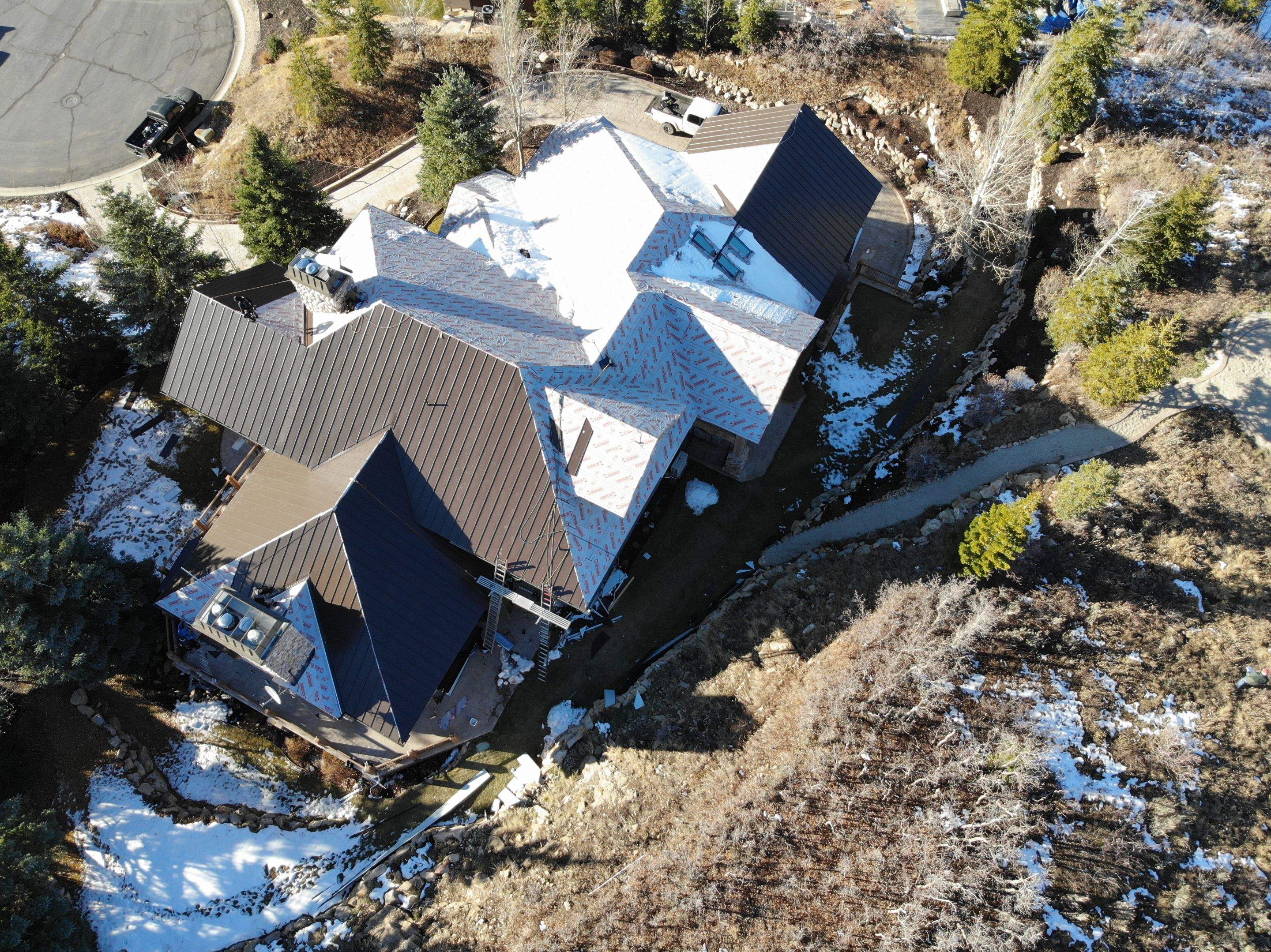 Standing Seam Metal Roof Replacement After Snow Damage by ASAP Roofing & Restoration