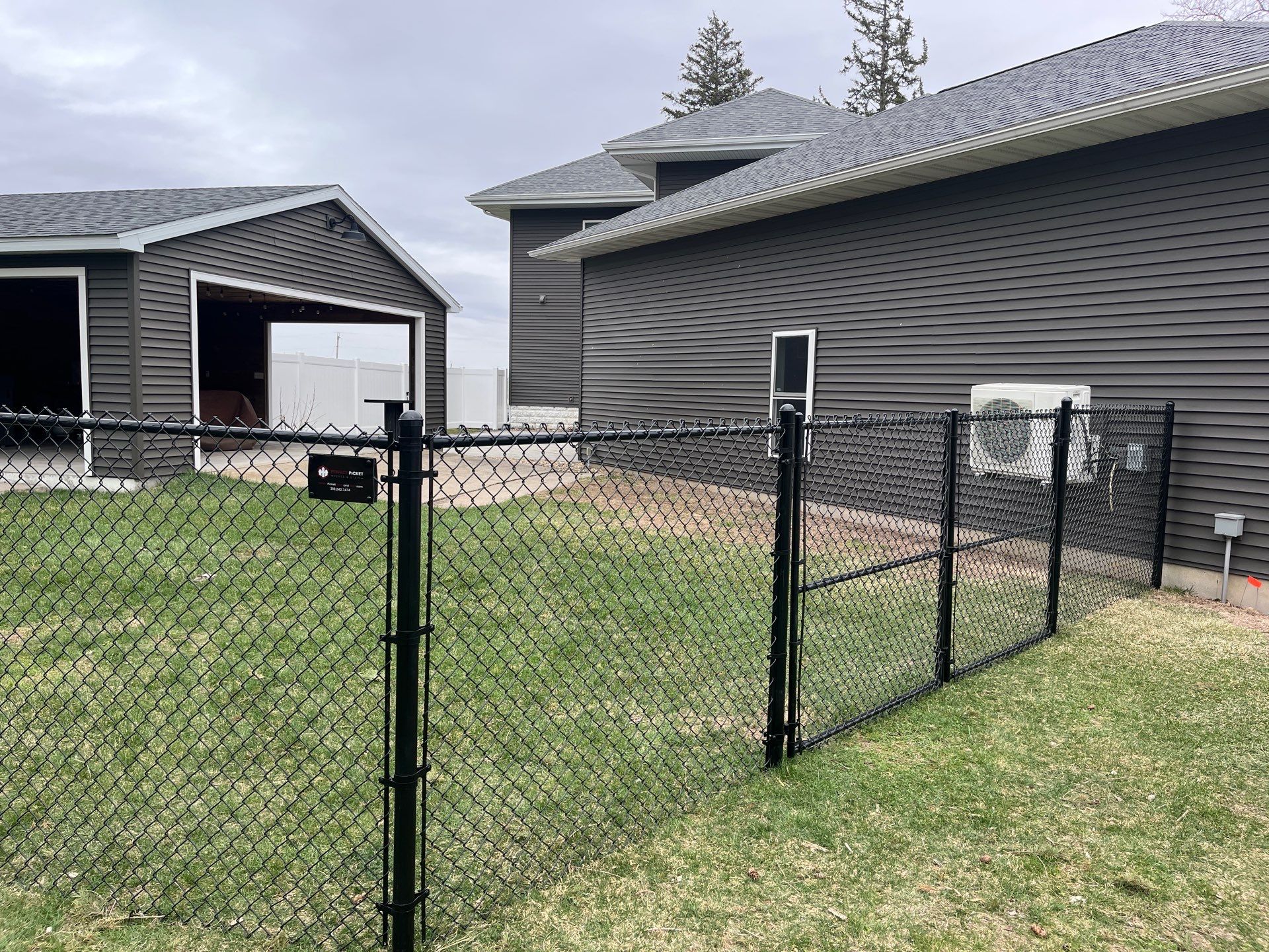 White Vinyl Privacy and Black Chain Link Fencing in Buckingham by Perfect Picket Fence and Stain