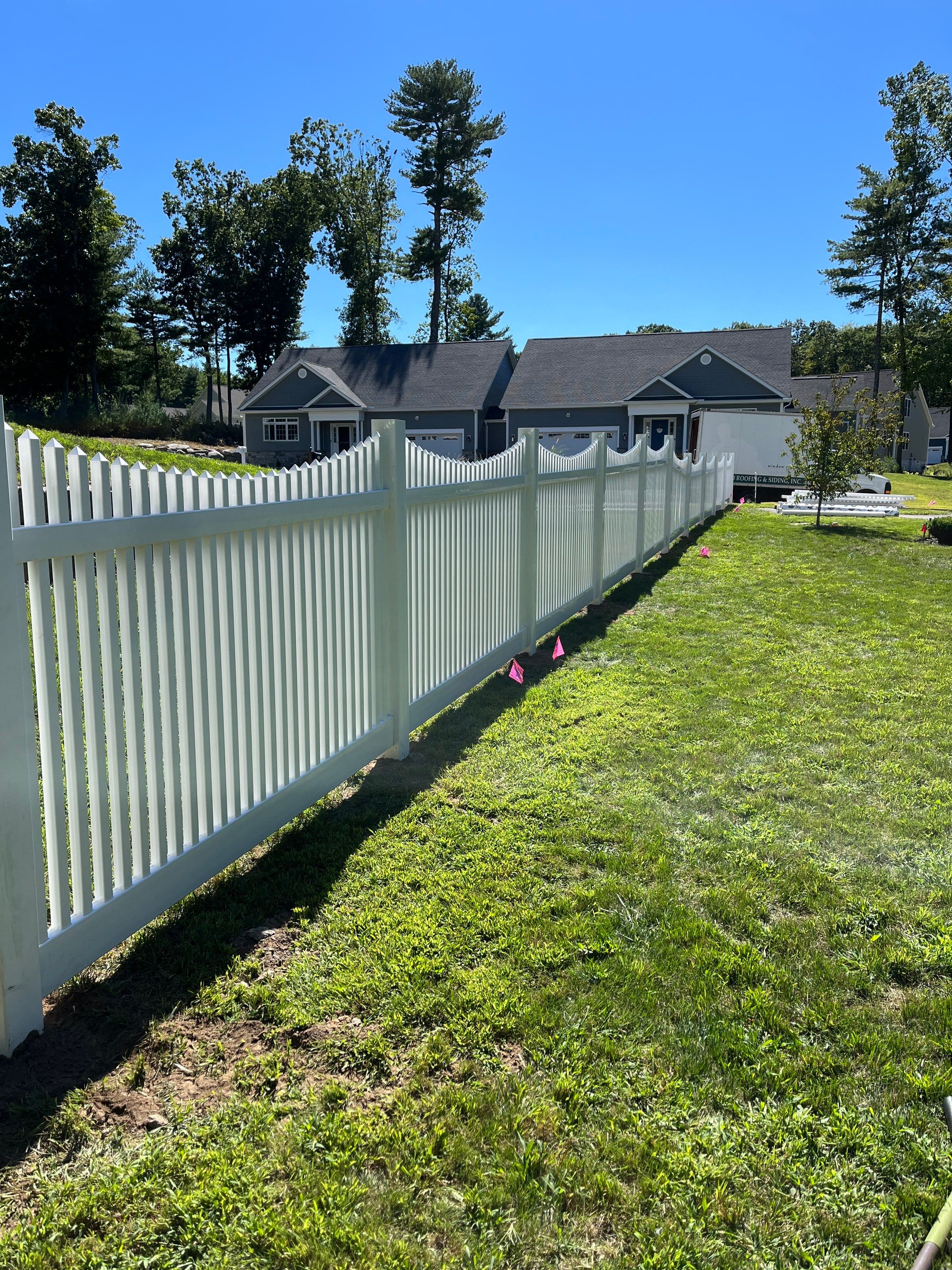 New Vinyl picket fence in white by DiGiorgi Roofing and Siding Inc