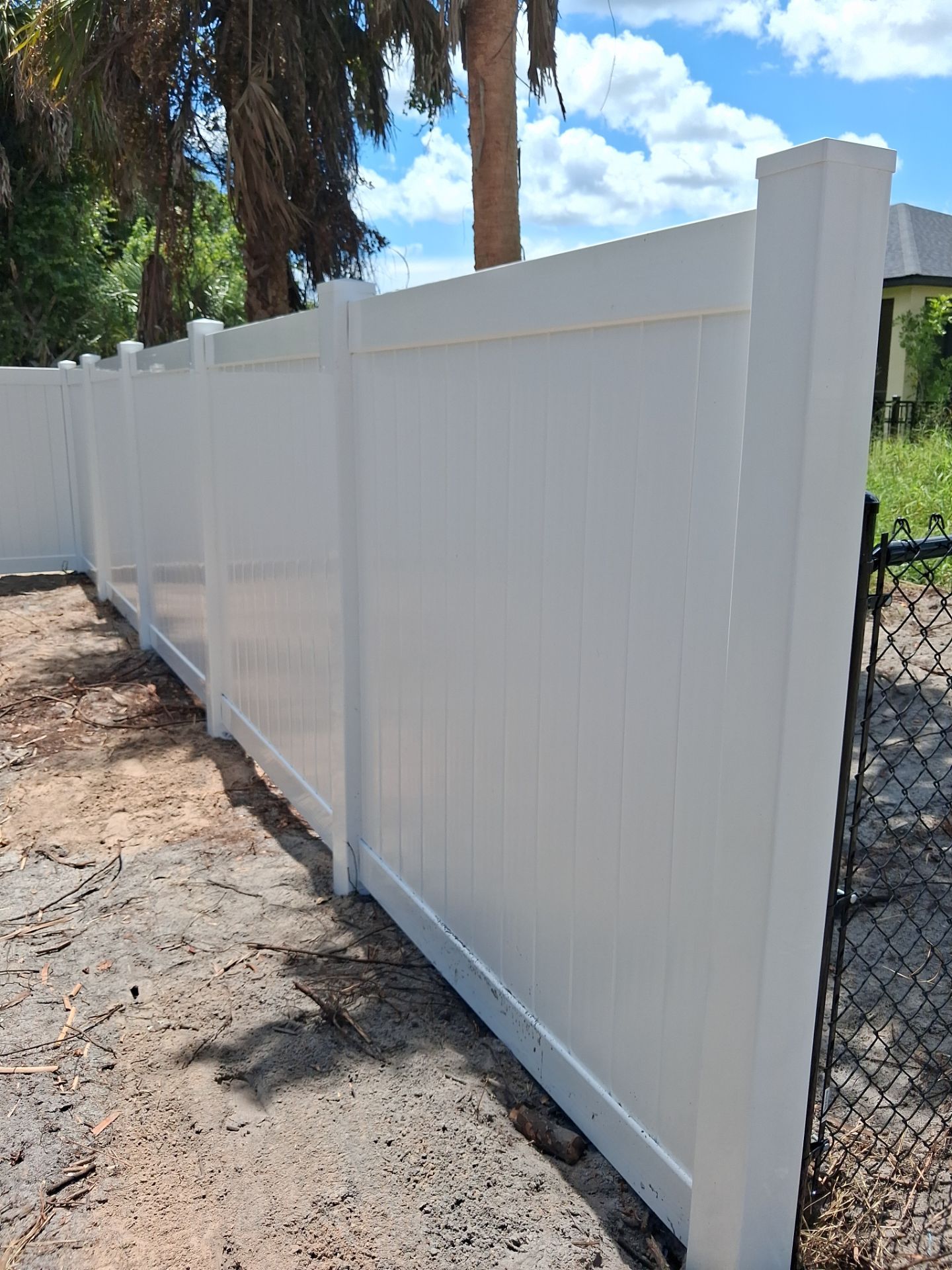 White Vinyl Privacy Fence Installation in North Port Florida by True Fence LLC