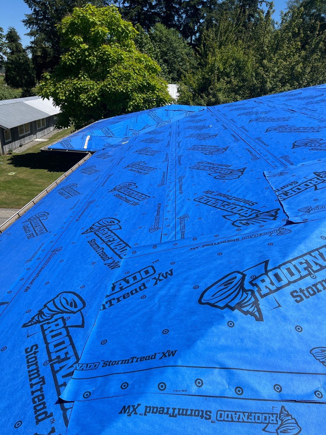 Residential Roofing Installation using 12" Prolok metal  by Top Notch Roofing Inc