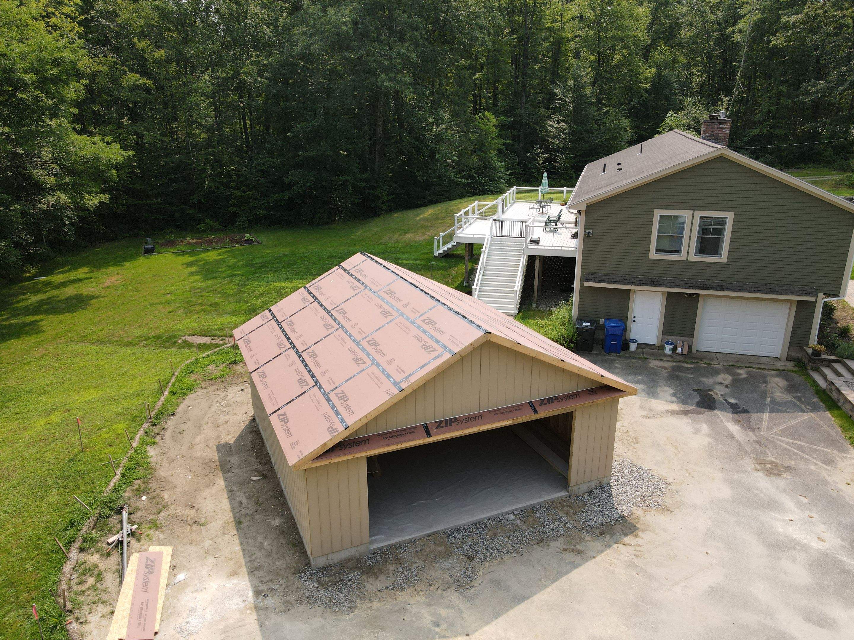 Two-Car Garage using LP SmartSide Panel Siding by Chagnon Building & Remodeling LLC