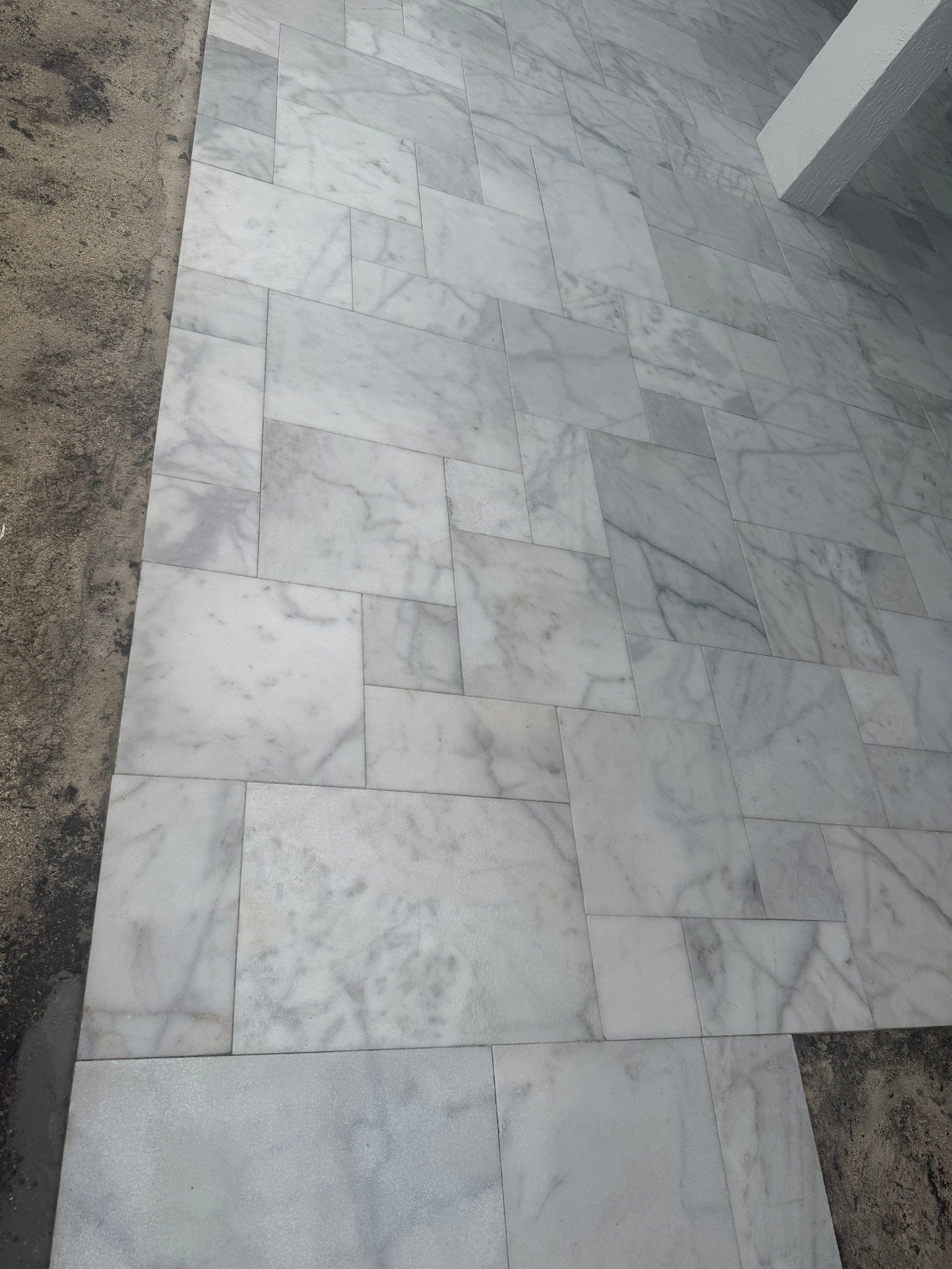 Bronze Aluminum Screen Enclosure and Marble Tile Patio in Boynton Beach by The Screen Depot, Inc