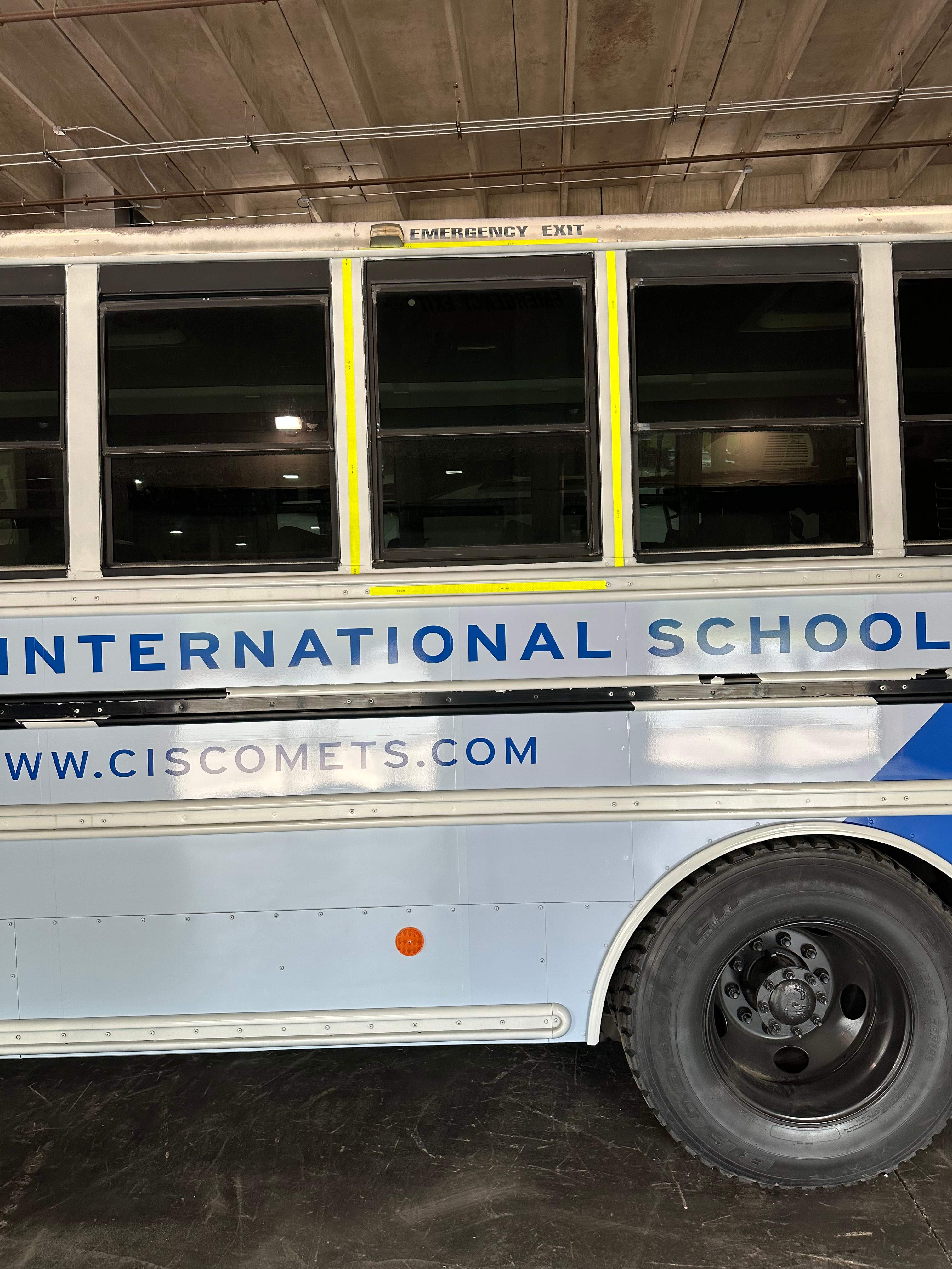 Carolina International School - Bus Vinyl Wrap by QC Signs and Graphics