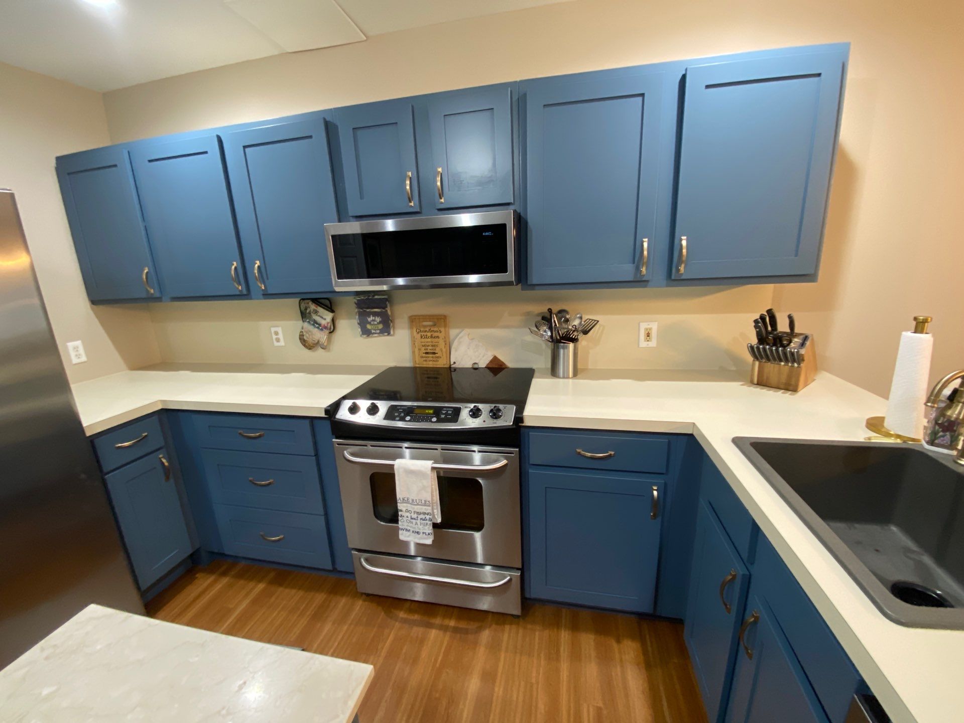 Blue-Grey Kitchen Cabinet Refinishing Transformation in White Lake by Top Shelf Painter