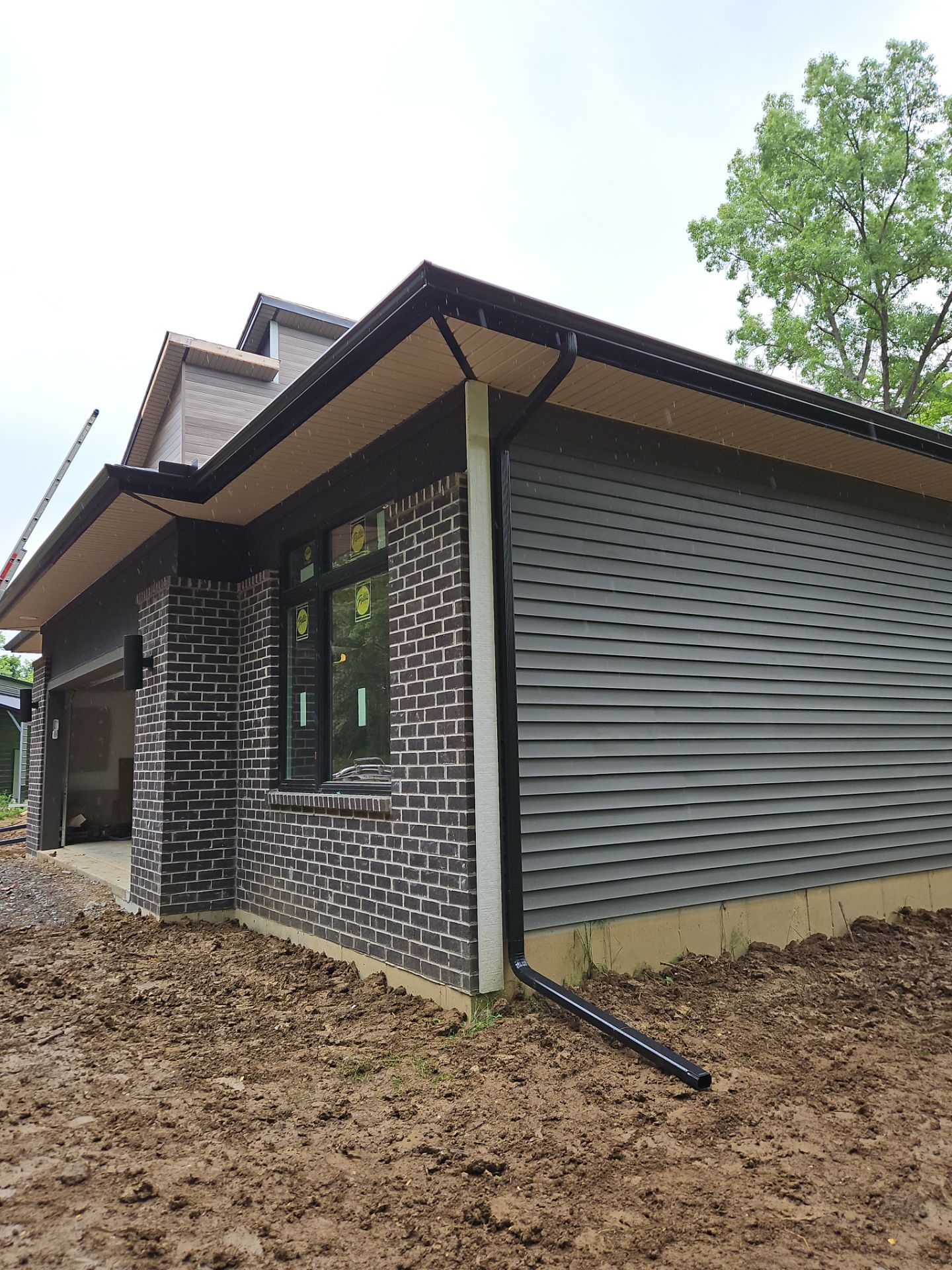 Gutter Installation using 5" Seamless Gutters and Downspouts by RoofX 