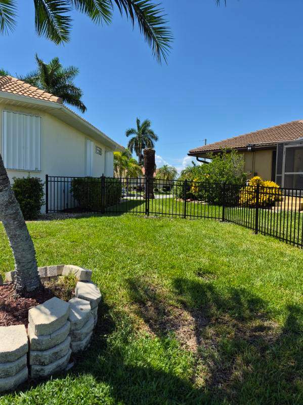 Custom Black Aluminum Fence Enclosure for Punta Gorda Waterfront Property by True Fence LLC