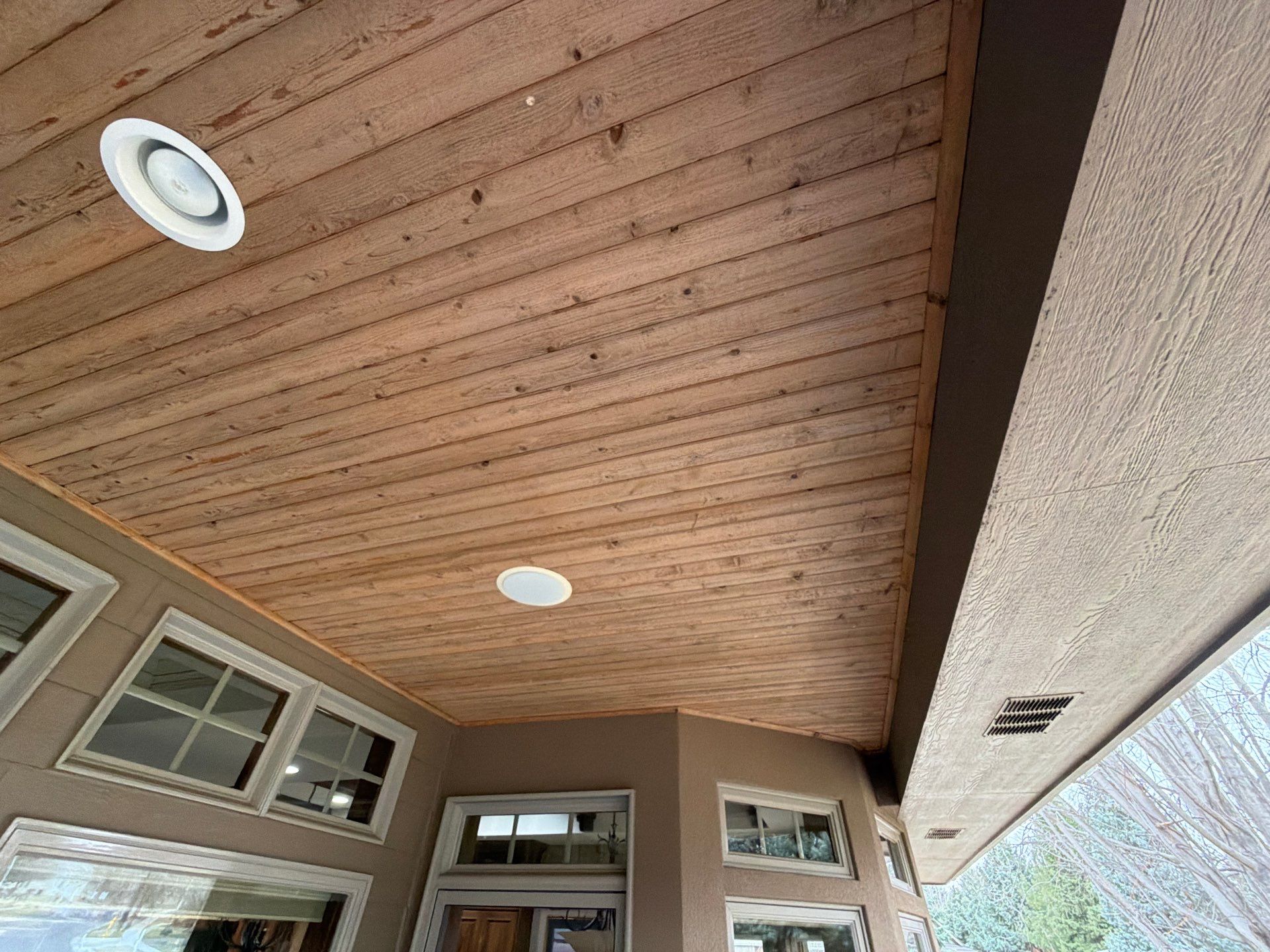 Deck Staining and Tongue and Groove Ceiling Refinish in Sioux Falls by Select Painting, Coatings & Garage Cabinets