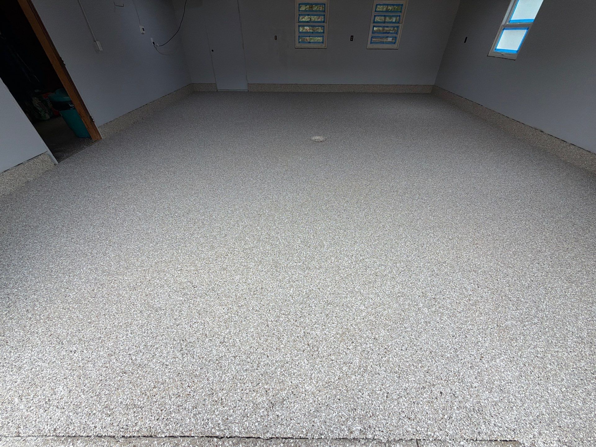 Garage Epoxy Flake Floor Installation and Exterior Siding Repairs in Muskegon by Gordon Painting
