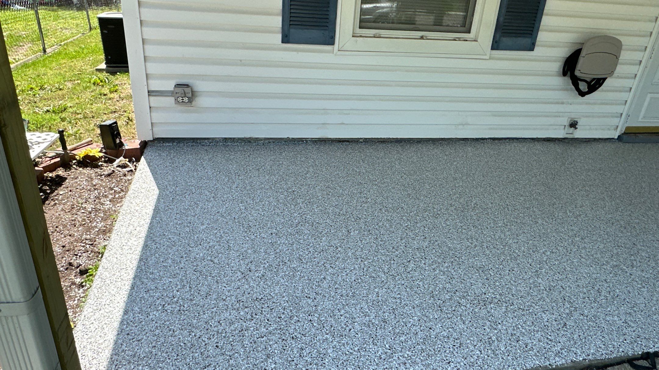 Look at this beautiful Coyote flake floor on this patio by Banner Garage