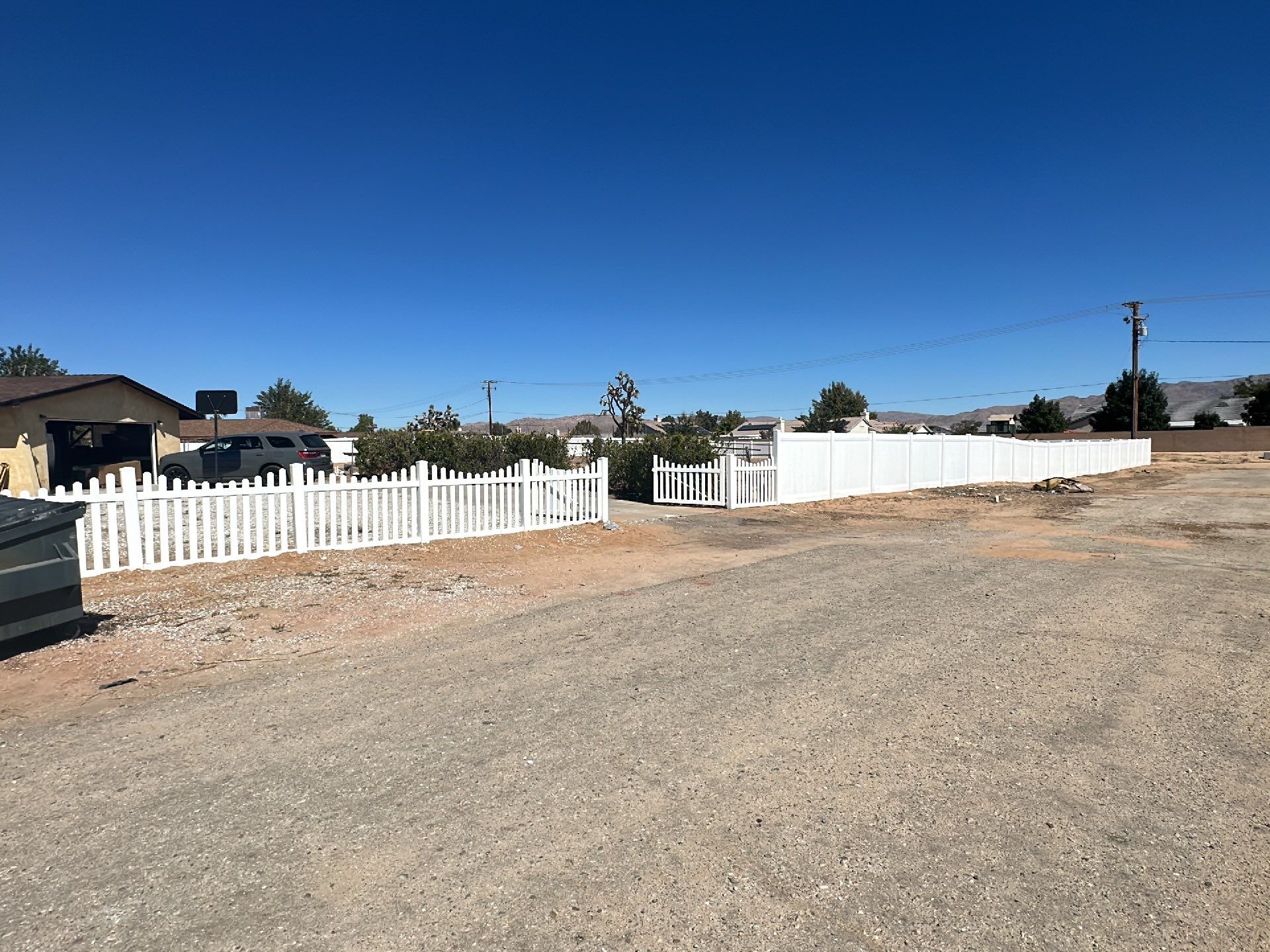 White picket fence  by Fence Guys Inc. 