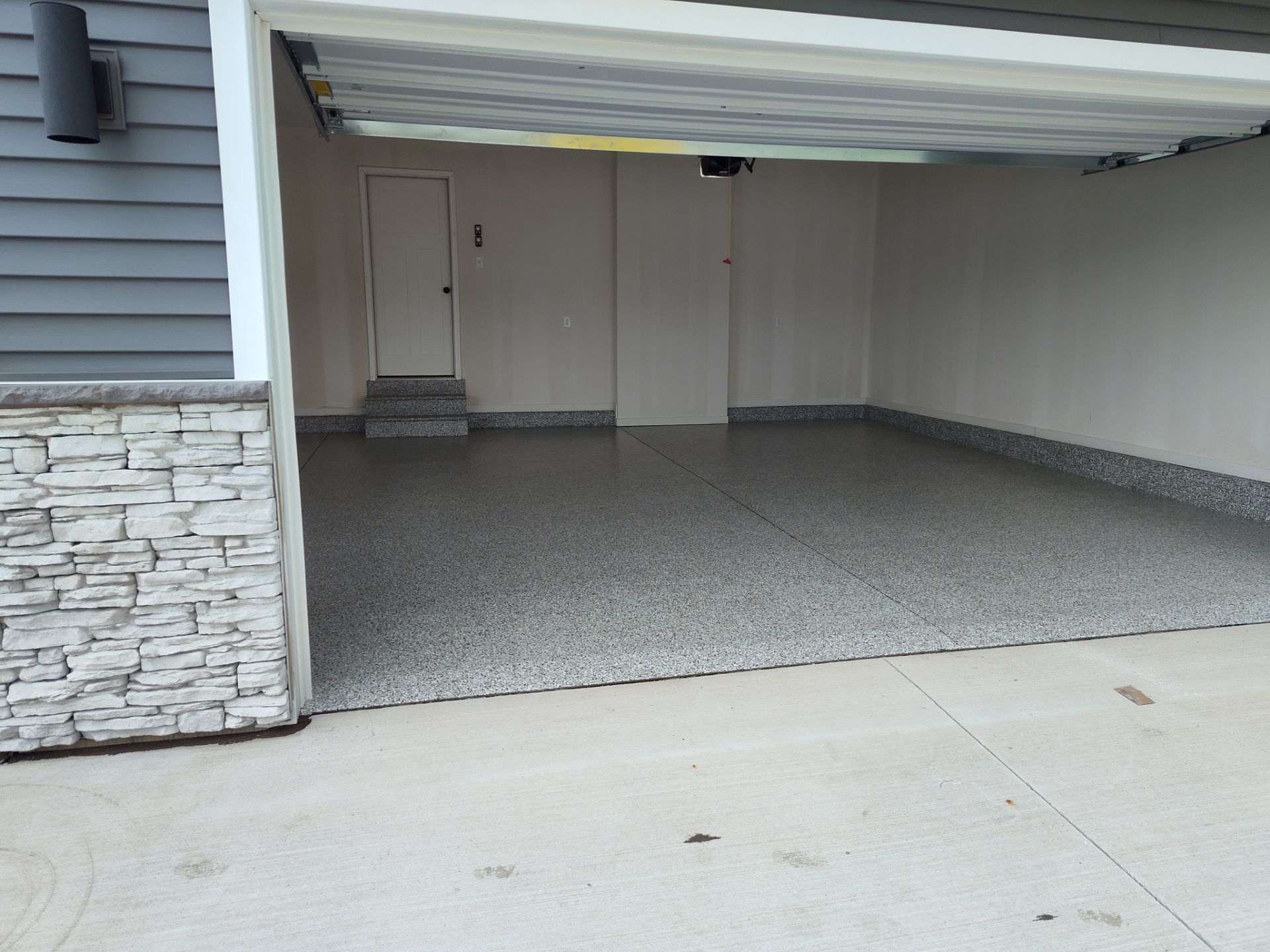 New Bondurant Garage Floor Coating by Revival Concrete Coatings, LLC