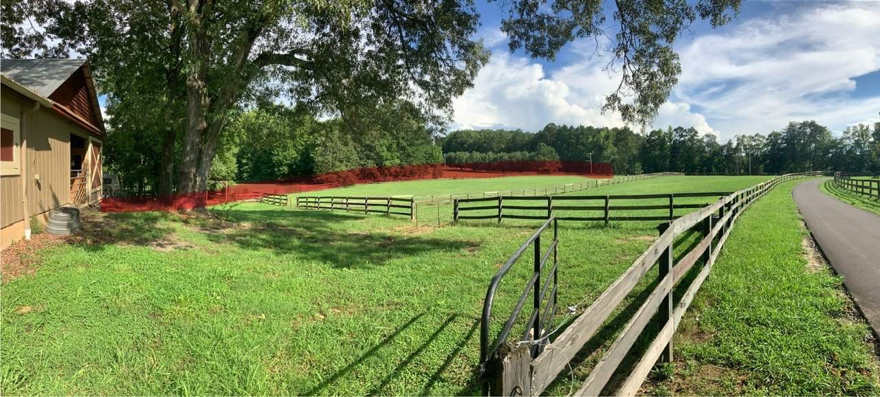 Fence Staining (Farm in Durham NC) by GonzalezPainters & Contractors Inc 