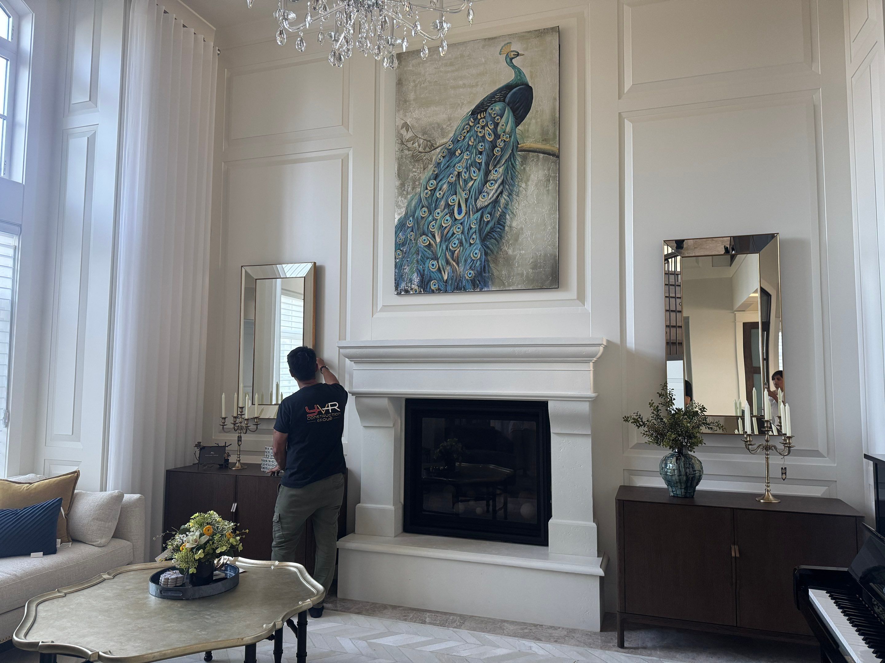 Professional Hanging of Mirrors & Art in a Designer Home by YVR Construction Group