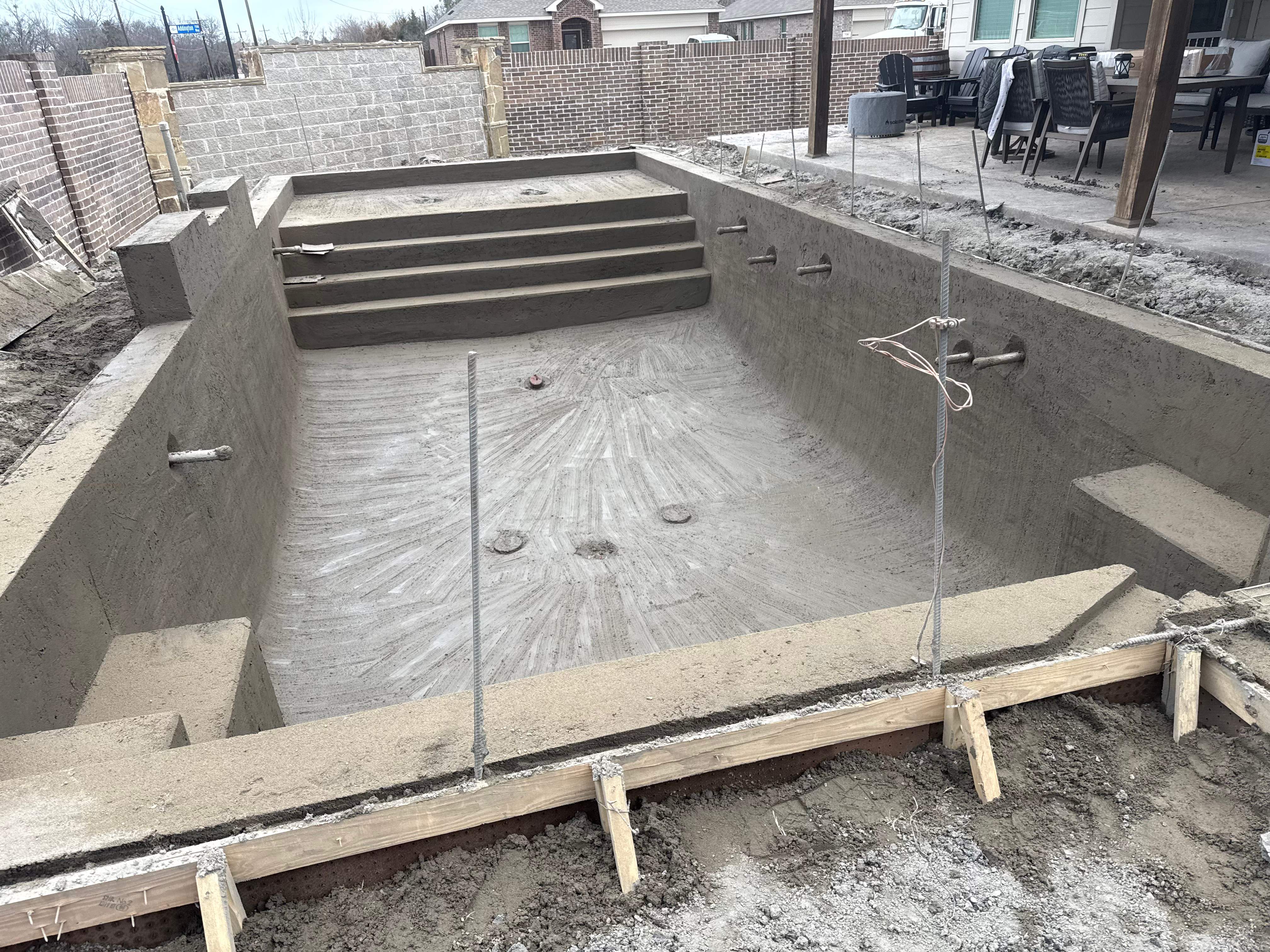 Rectangular Pool with Tanning Ledge and Waterfall by Pinnacle Pools and Spas - DFW