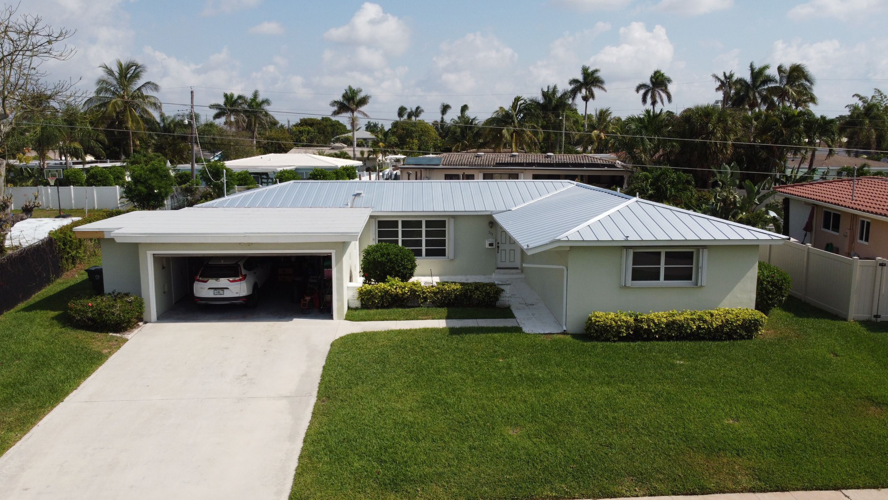 Residential Roofing Installation using 1" Nail strip metal roof by BLUES BROTHERS CONSTRUCTION CORP