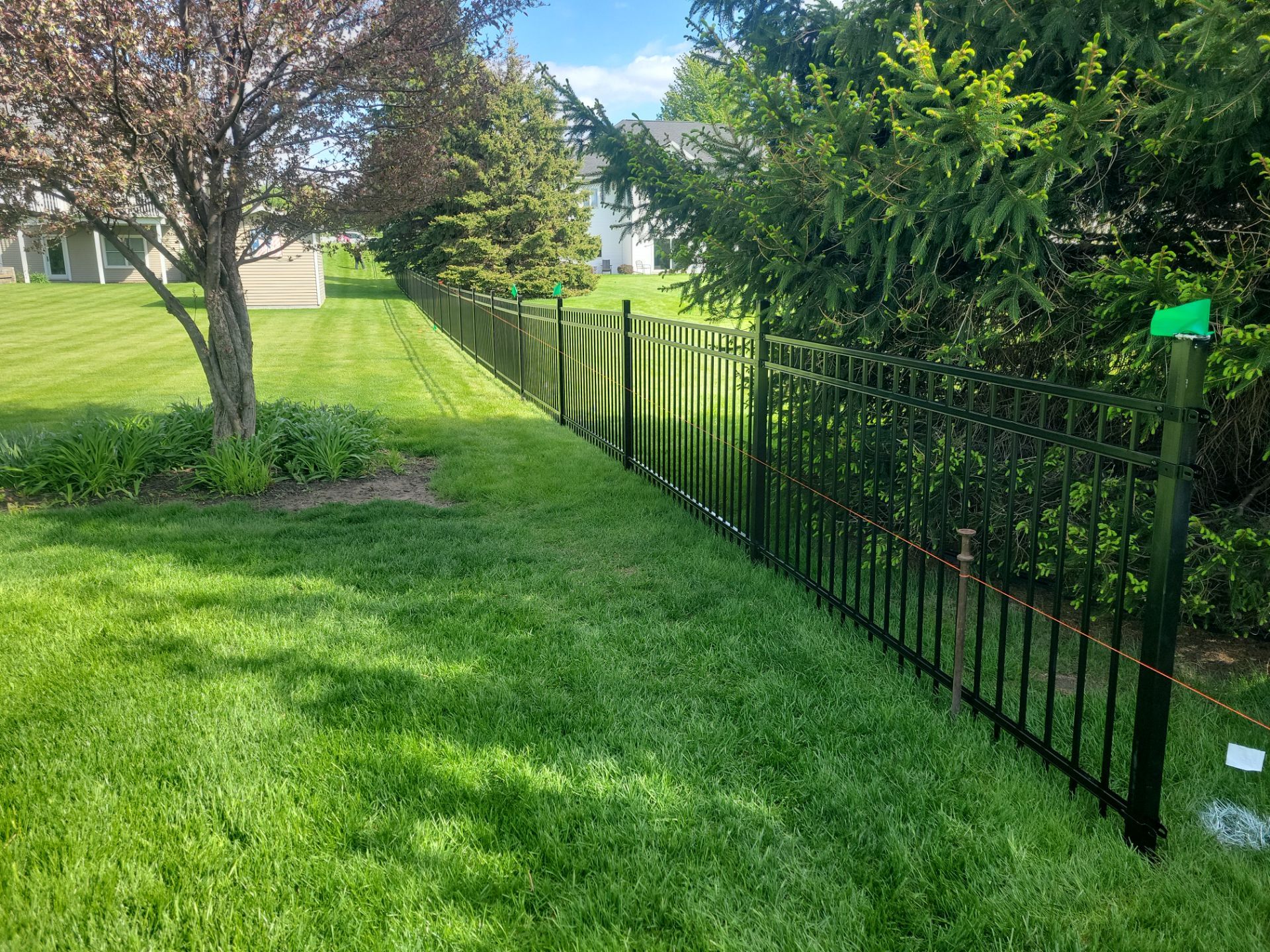 Black Ornamental Metal Picket Fence Installation in Waterloo by Perfect Picket Fence and Stain