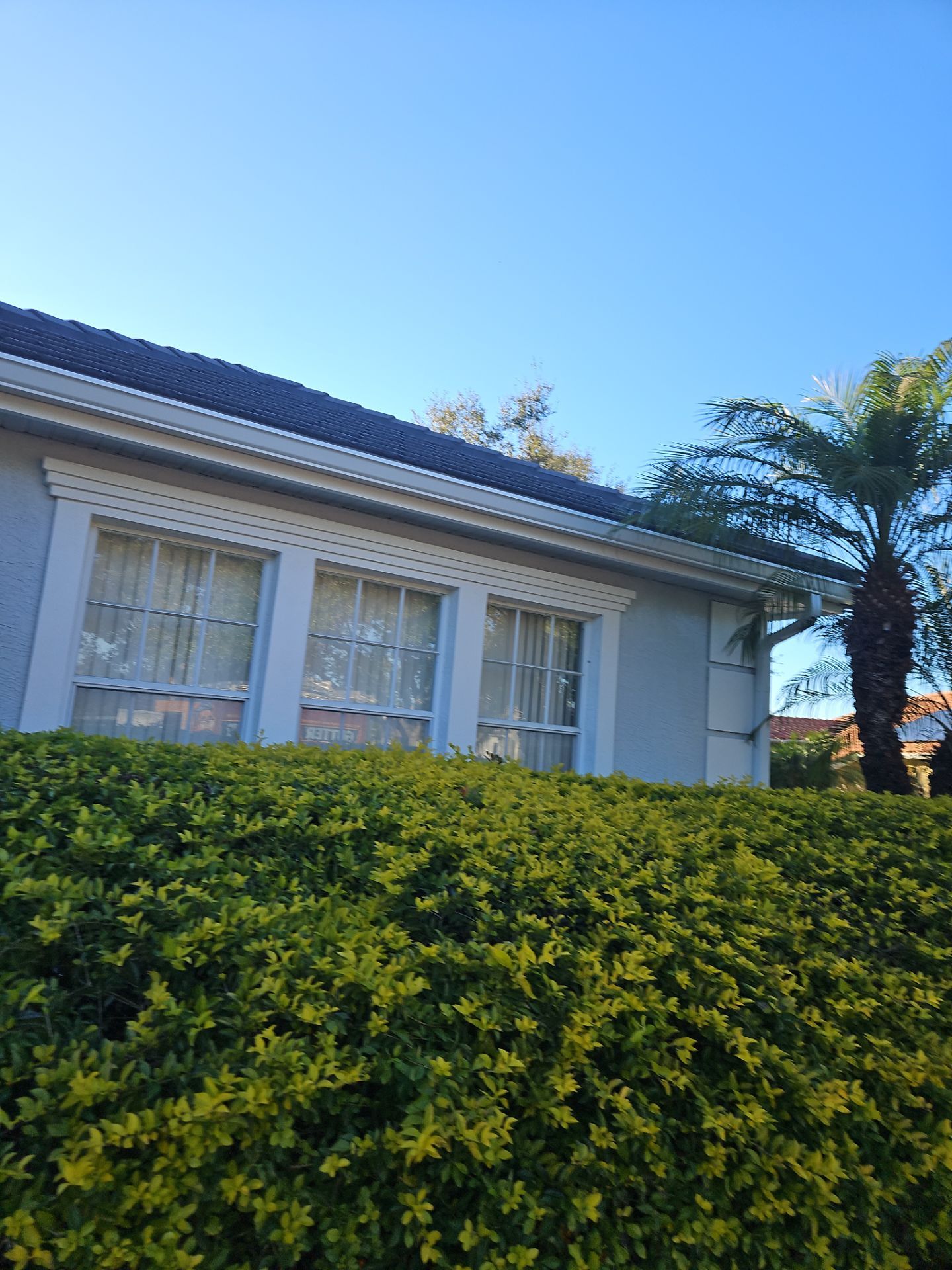 White Down Spouts using downspouts and White Seamless Gutters in Sarasota FL by Gutter Professors