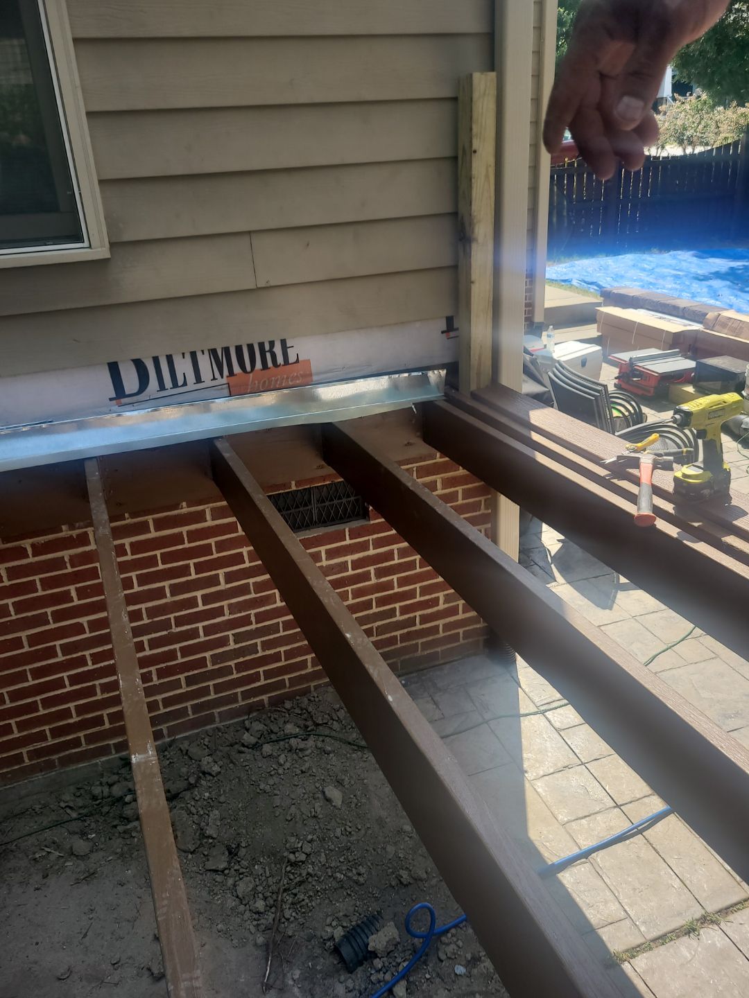 Fuquay-Varina Outdoor Upgrade – Composite Deck & Paved Landing by Elite Remodeling and Design LLC