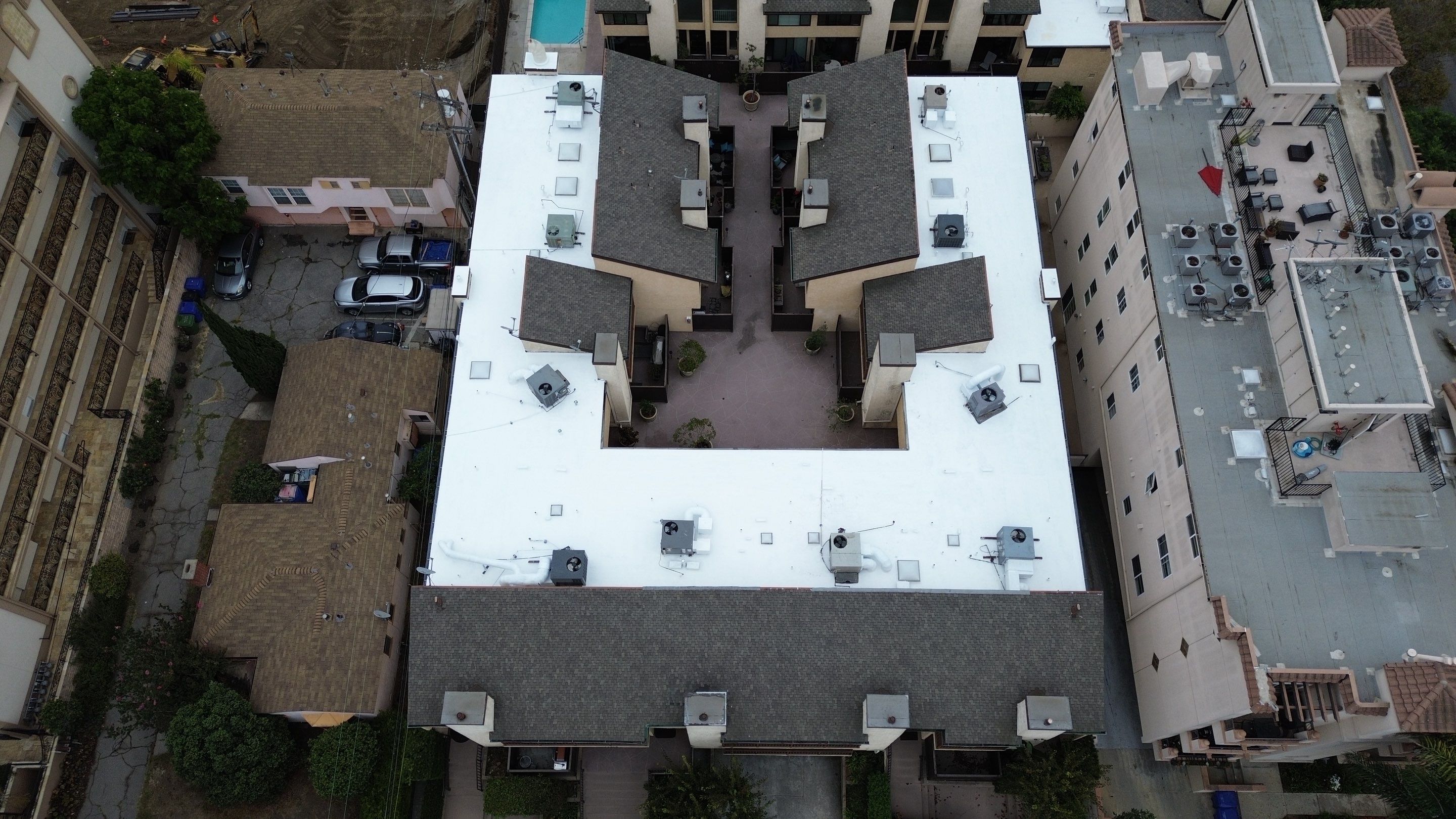 Apartment Building Silicone Coating by Hull Brothers Roofing