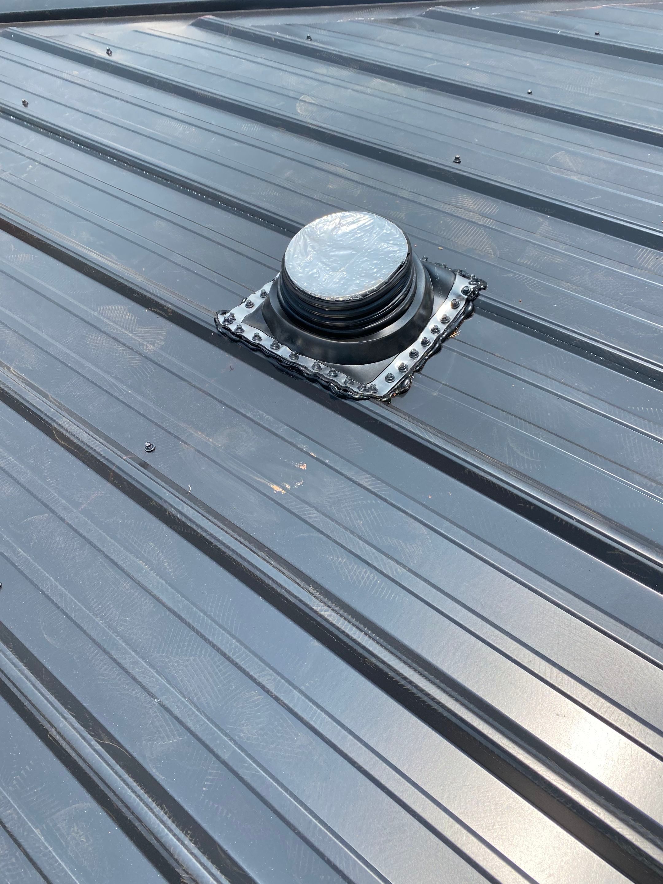 Jason's metal porch roof by BROCK BUILDERS 