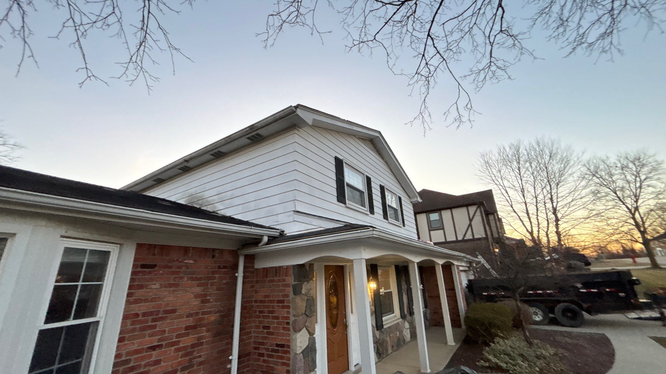 Siding Replacement using Alside Charcoal Smoke and Roof Replacement using Owens Corning Peppercorn by 180 Contractors