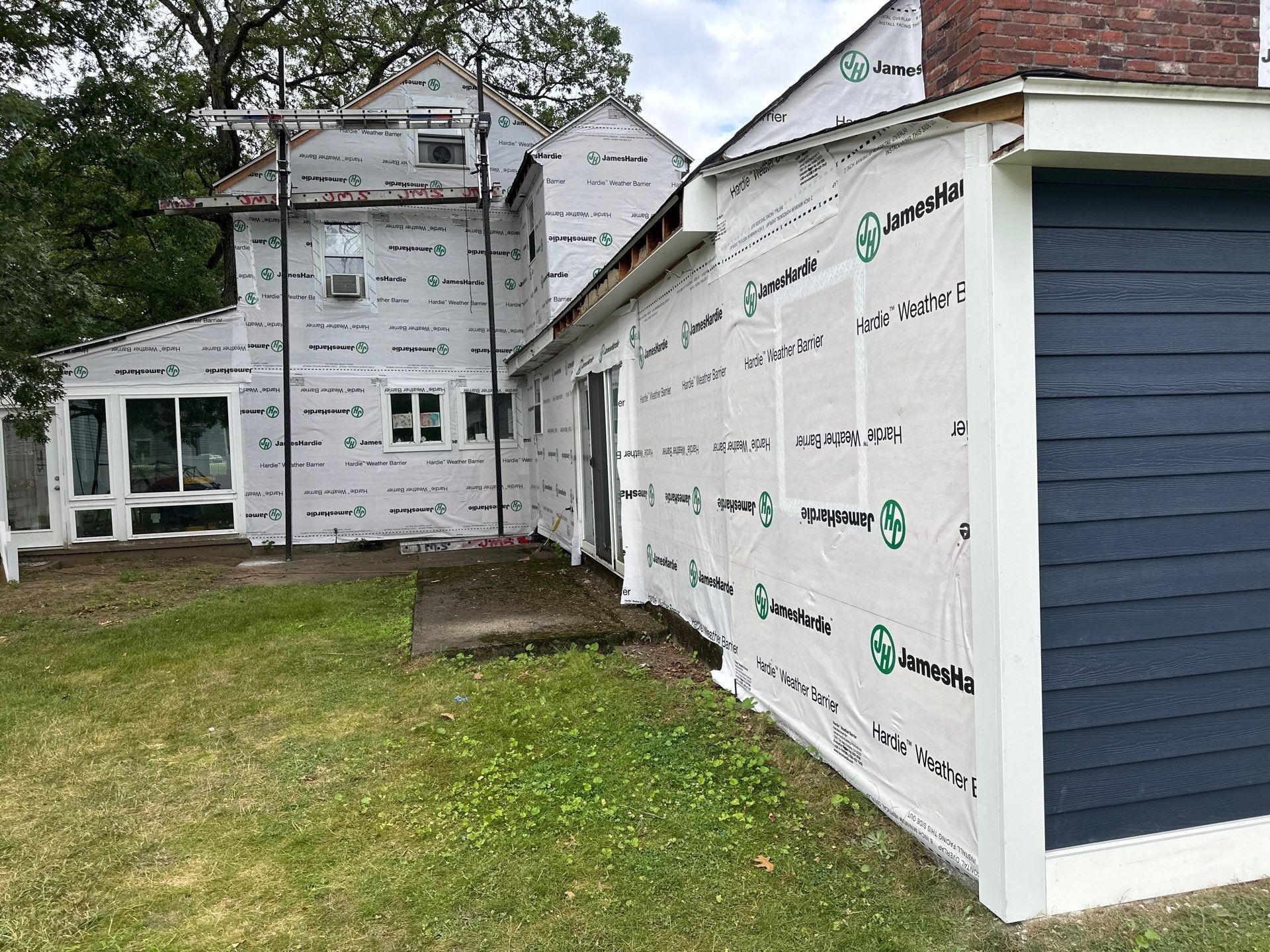 James Hardie Lap Siding Installation in Chelmsford, MA by Mighty Dog Roofing of Greater Middlesex County